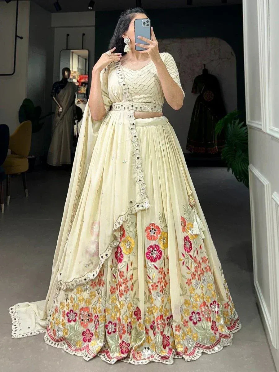 Cream floral embroidered lehenga choli with mirror work, perfect for Indian ethnic occasions