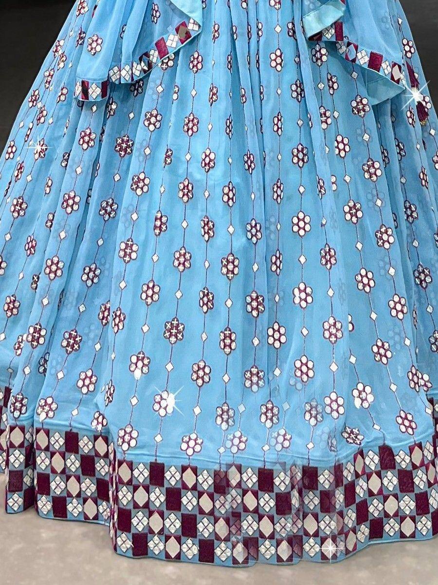 Light blue lehenga with maroon floral embroidery and geometric border, ideal for Indian ethnic wear