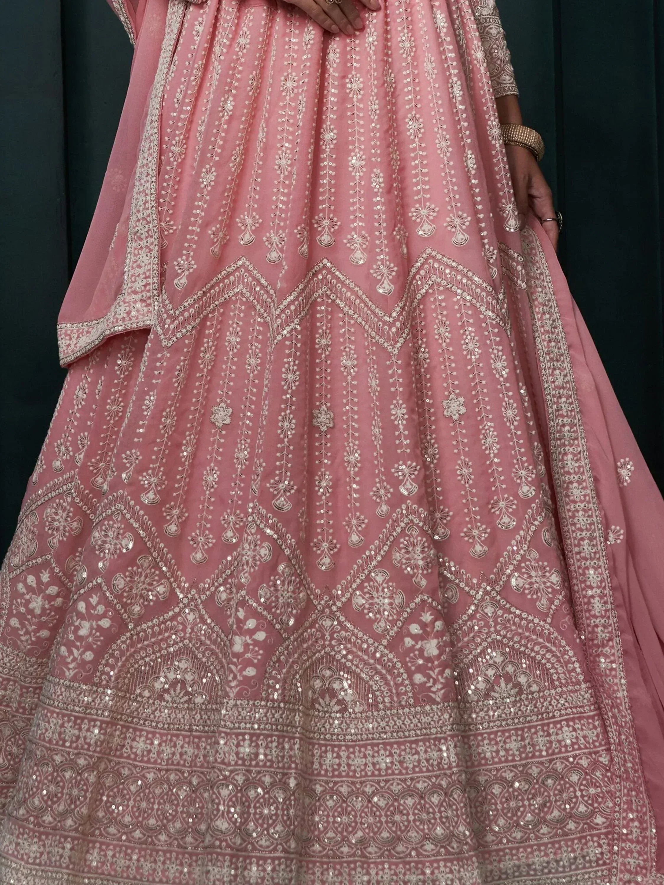 Pink designer lehenga choli with intricate silver embroidery and sequin work, perfect for Indian ethnic occasions.