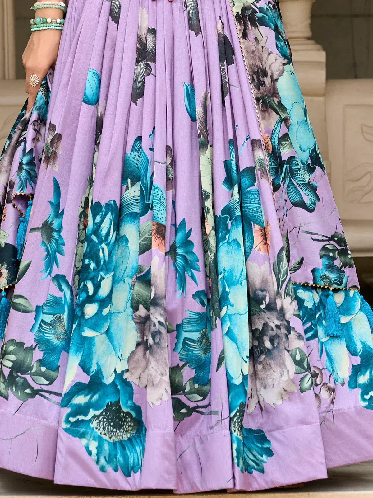 Lavender lehenga with teal floral print, pleated skirt, and gold trim for Indian ethnic wear