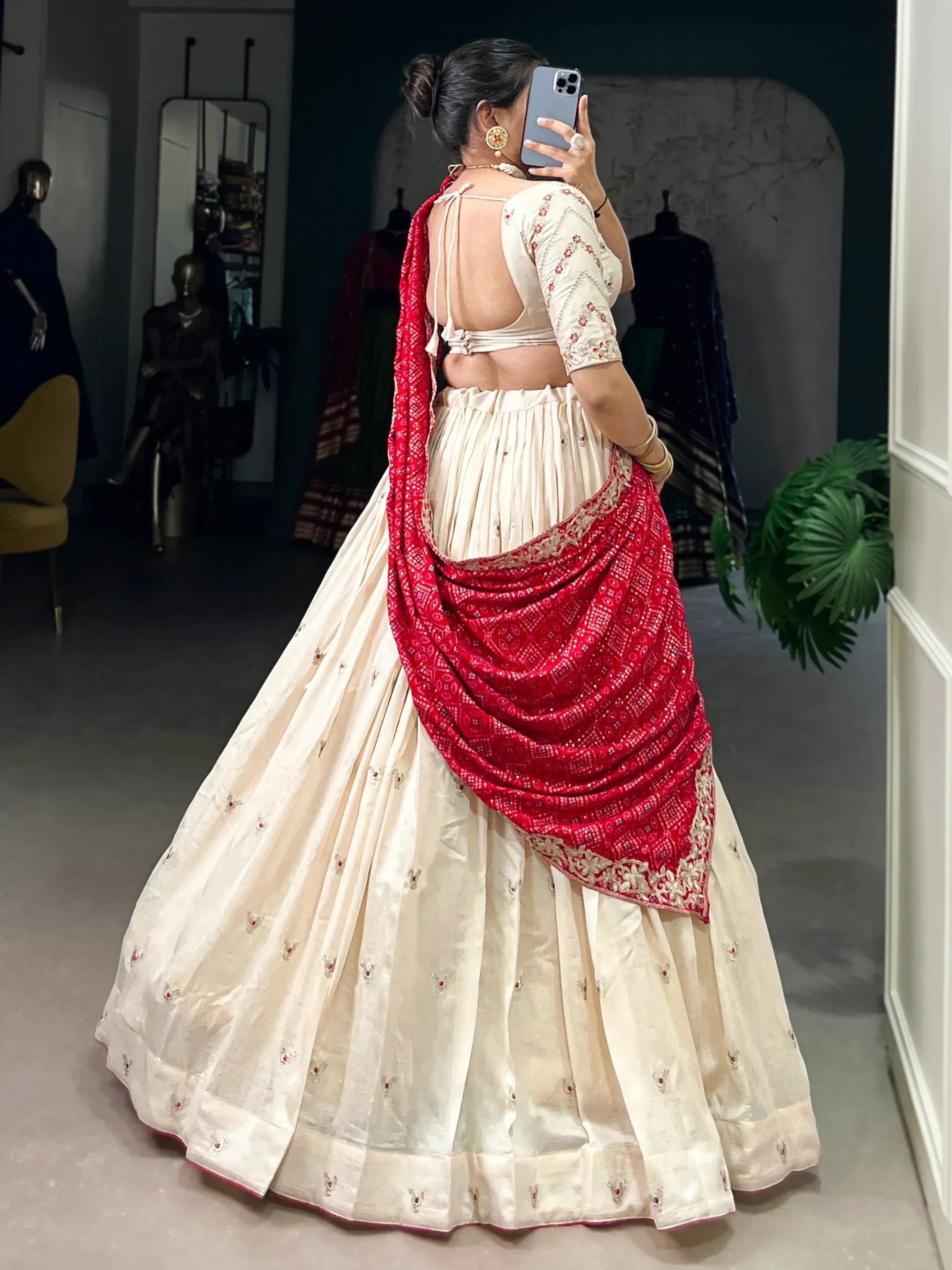 Cream lehenga choli with red dupatta, back view, ethnic Indian wear for weddings