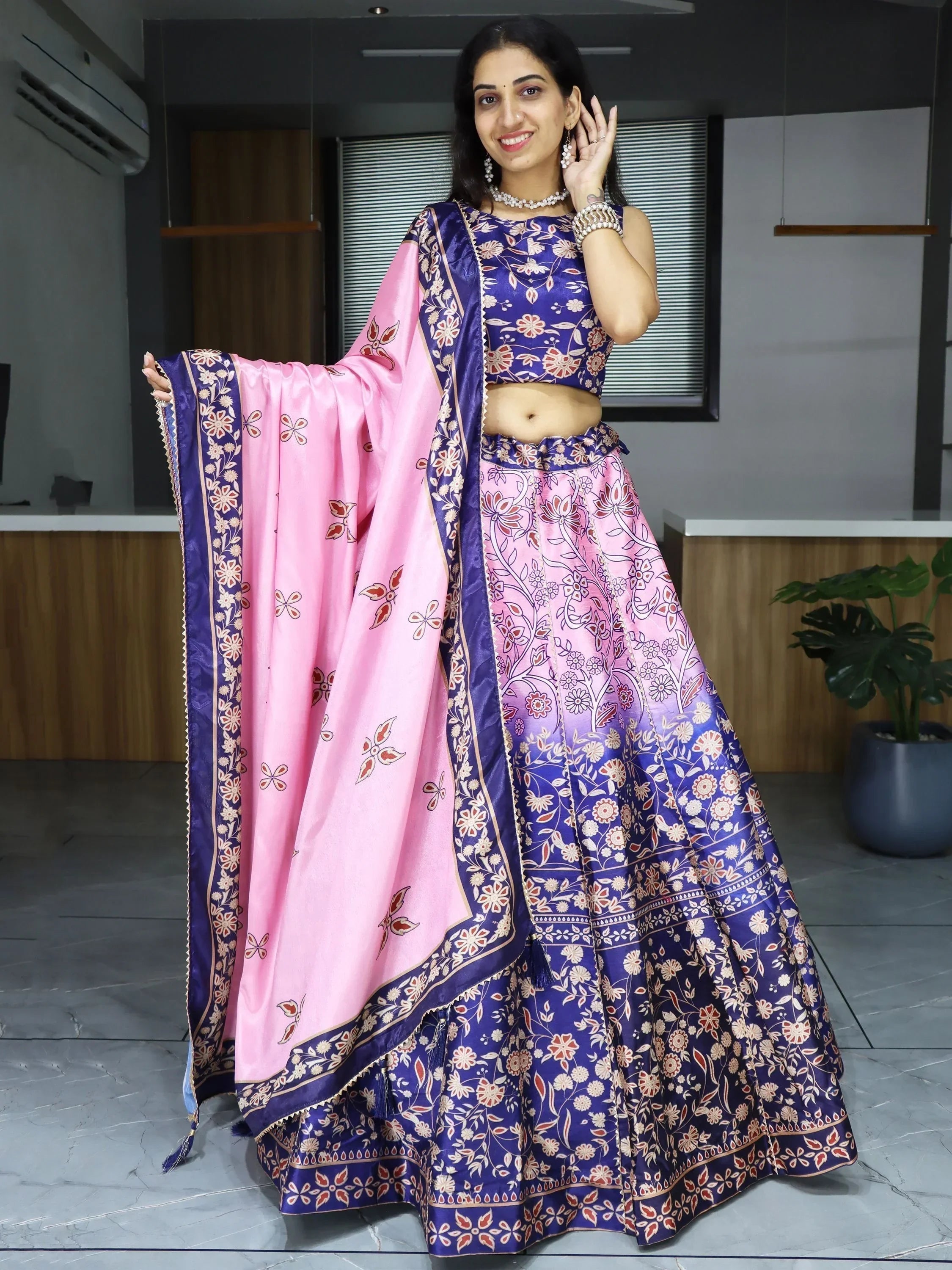 Woman in purple and pink floral lehenga choli with matching dupatta, Indian ethnic wear