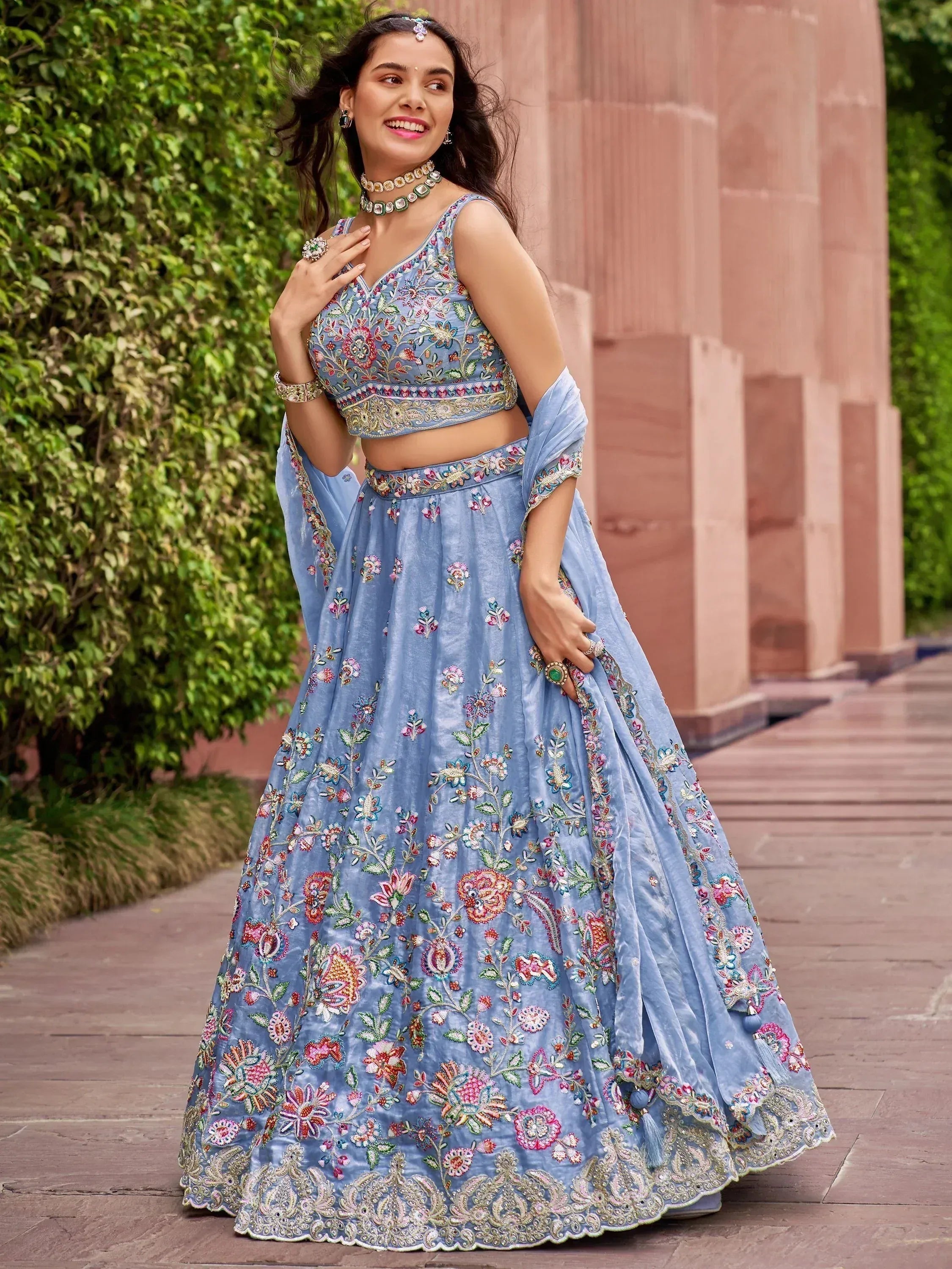 Blue floral embroidered lehenga choli with matching dupatta, perfect for Indian weddings and festive occasions.