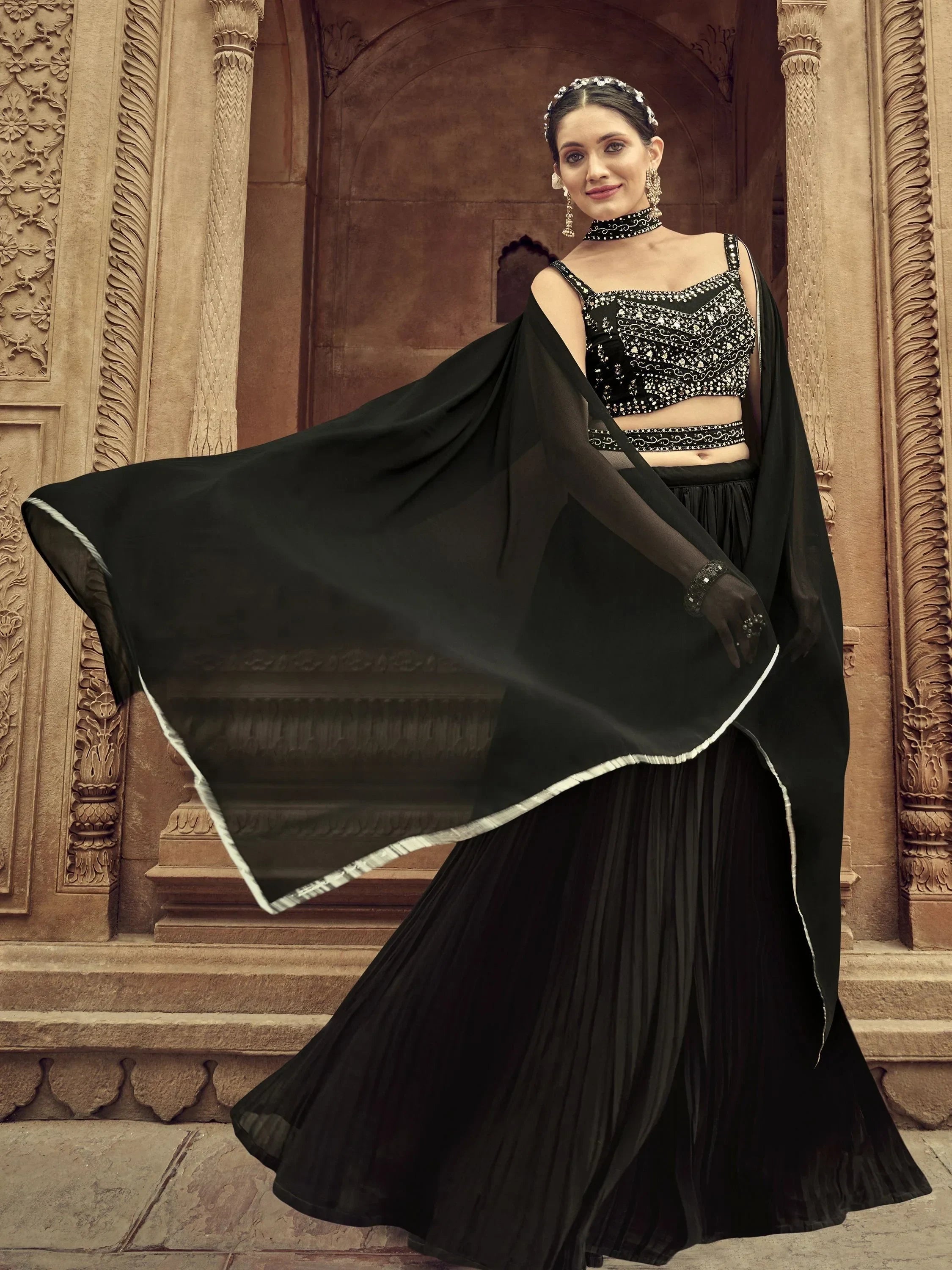 Black embroidered lehenga choli with flowing dupatta, perfect for Indian ethnic wear events