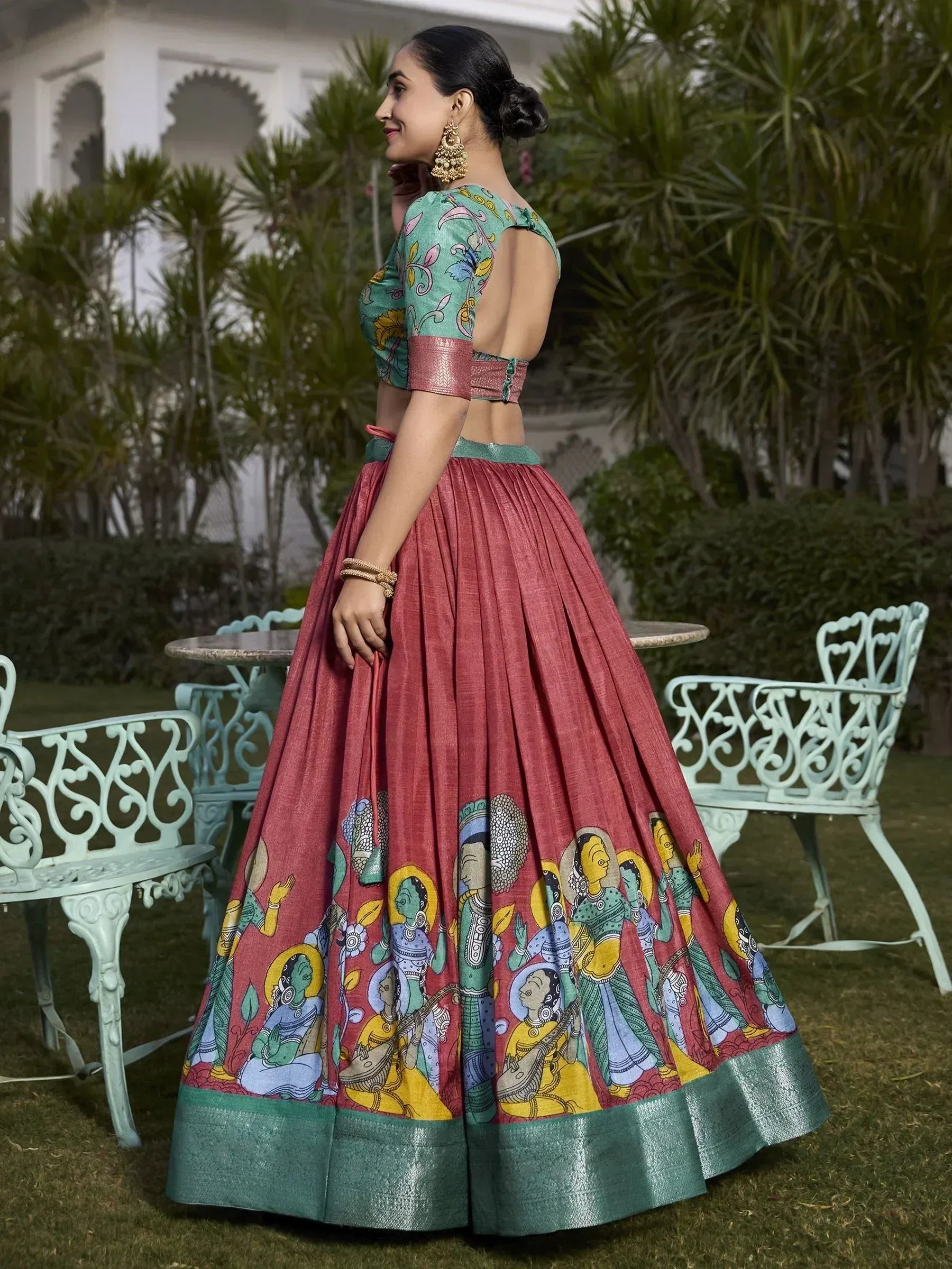 Woman in printed lehenga choli with backless blouse, ethnic Indian wear for festive occasions