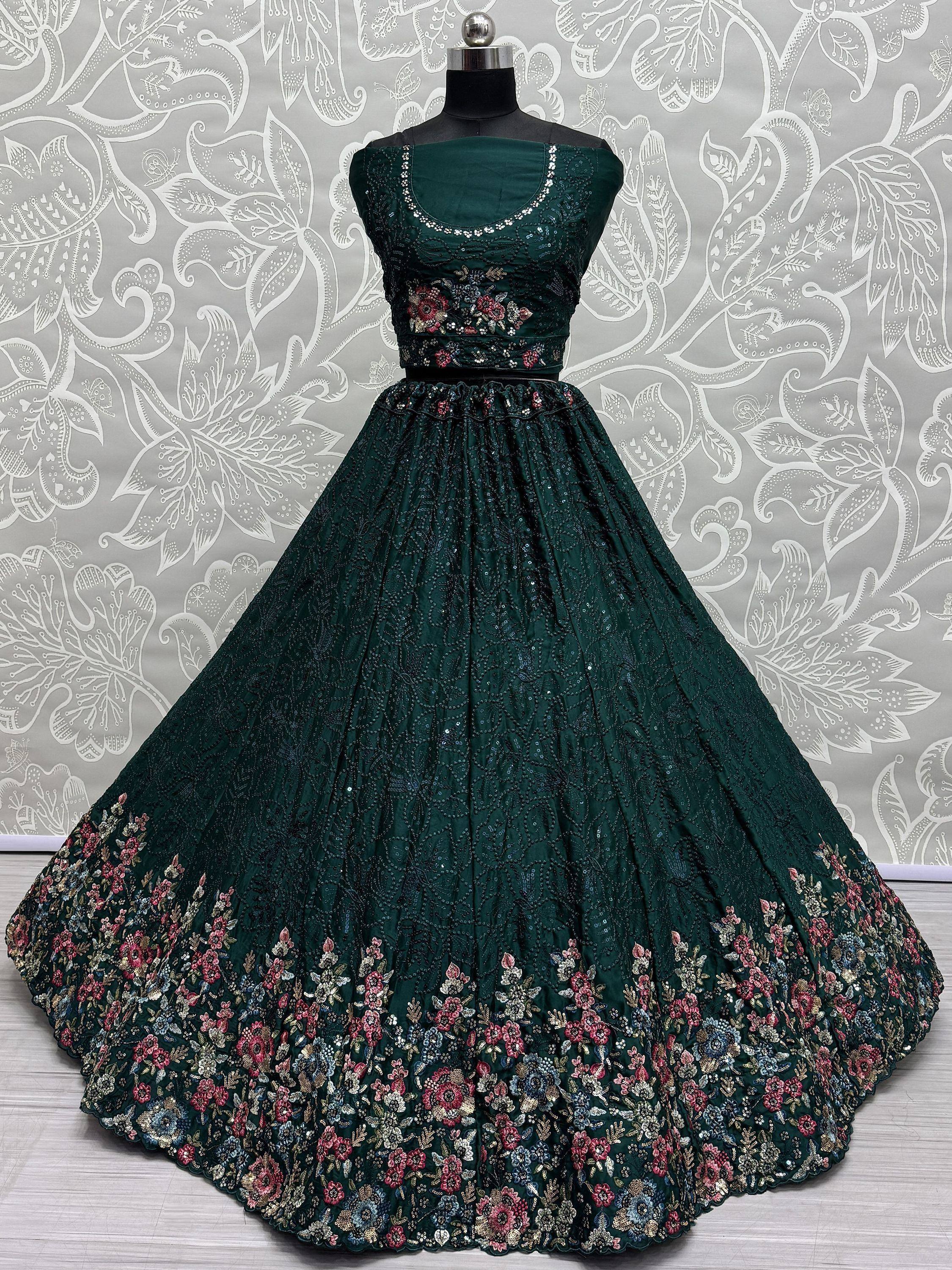 Emerald green embroidered lehenga choli with floral motifs and sequin detailing, perfect for Indian ethnic wear.