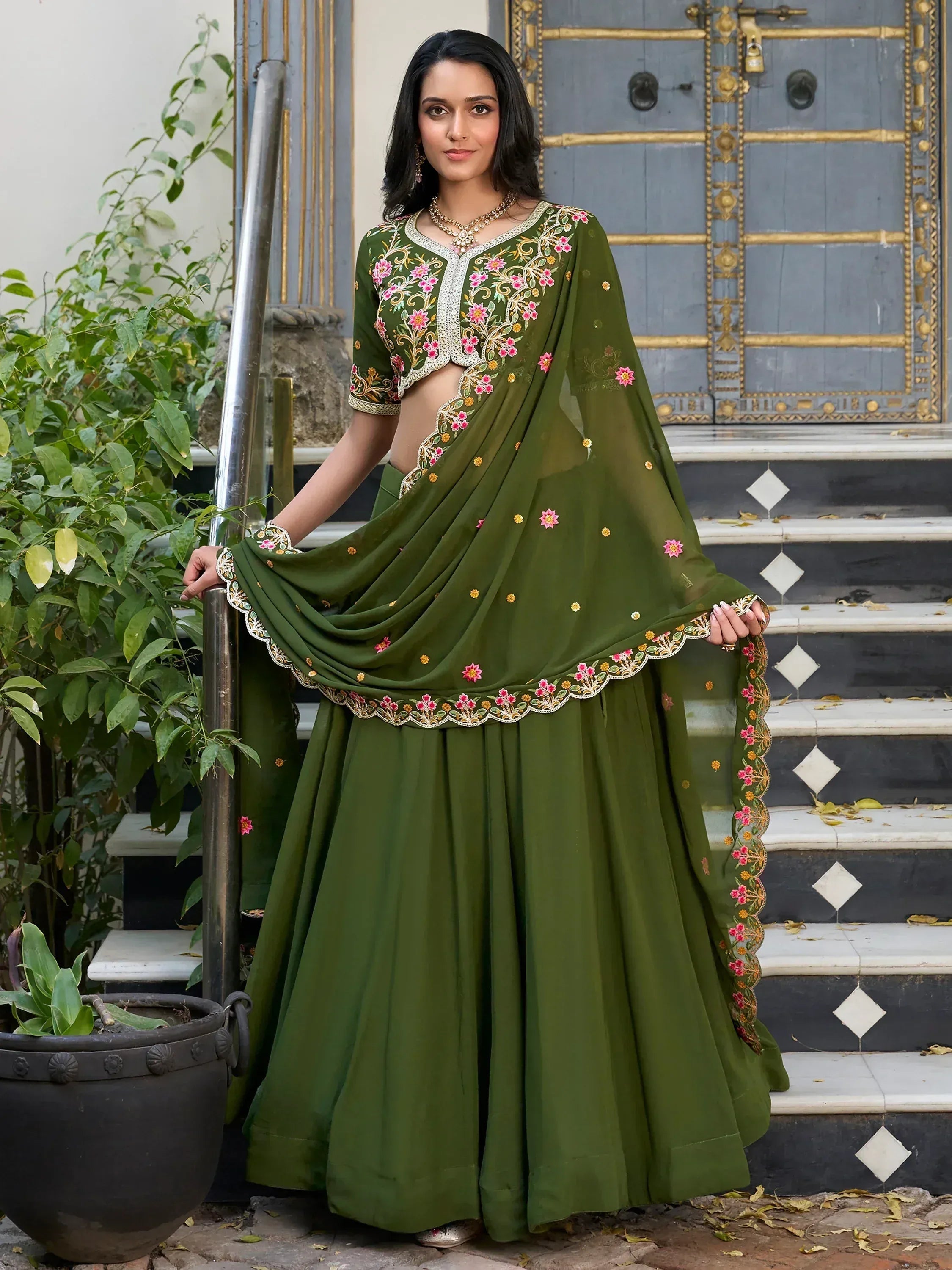 Olive green embroidered lehenga choli with floral detailing, perfect for Indian ethnic wear occasions.