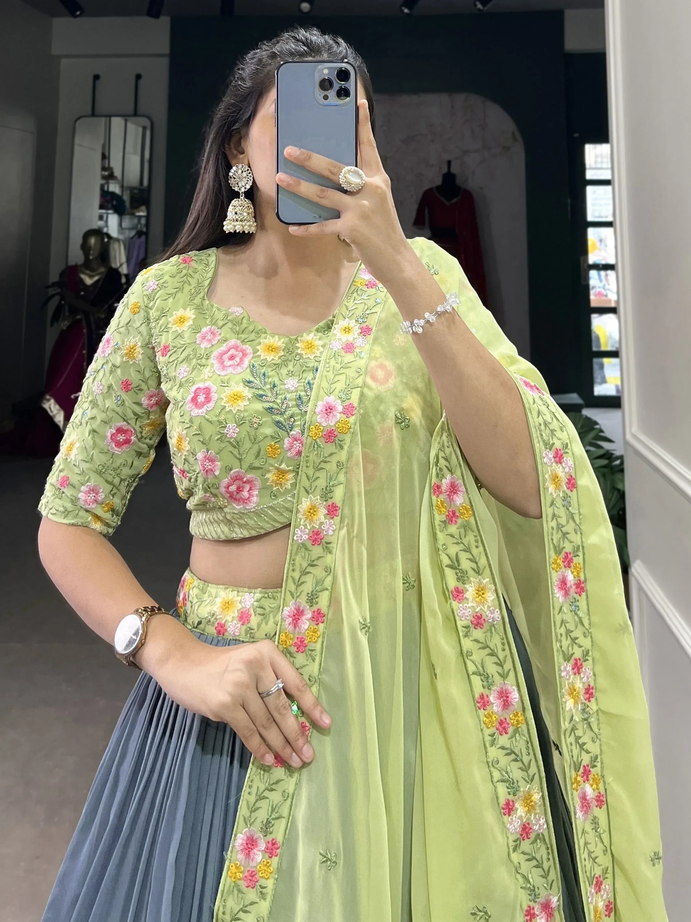 Light green floral embroidered lehenga choli with matching dupatta, perfect for Indian ethnic wear occasions.