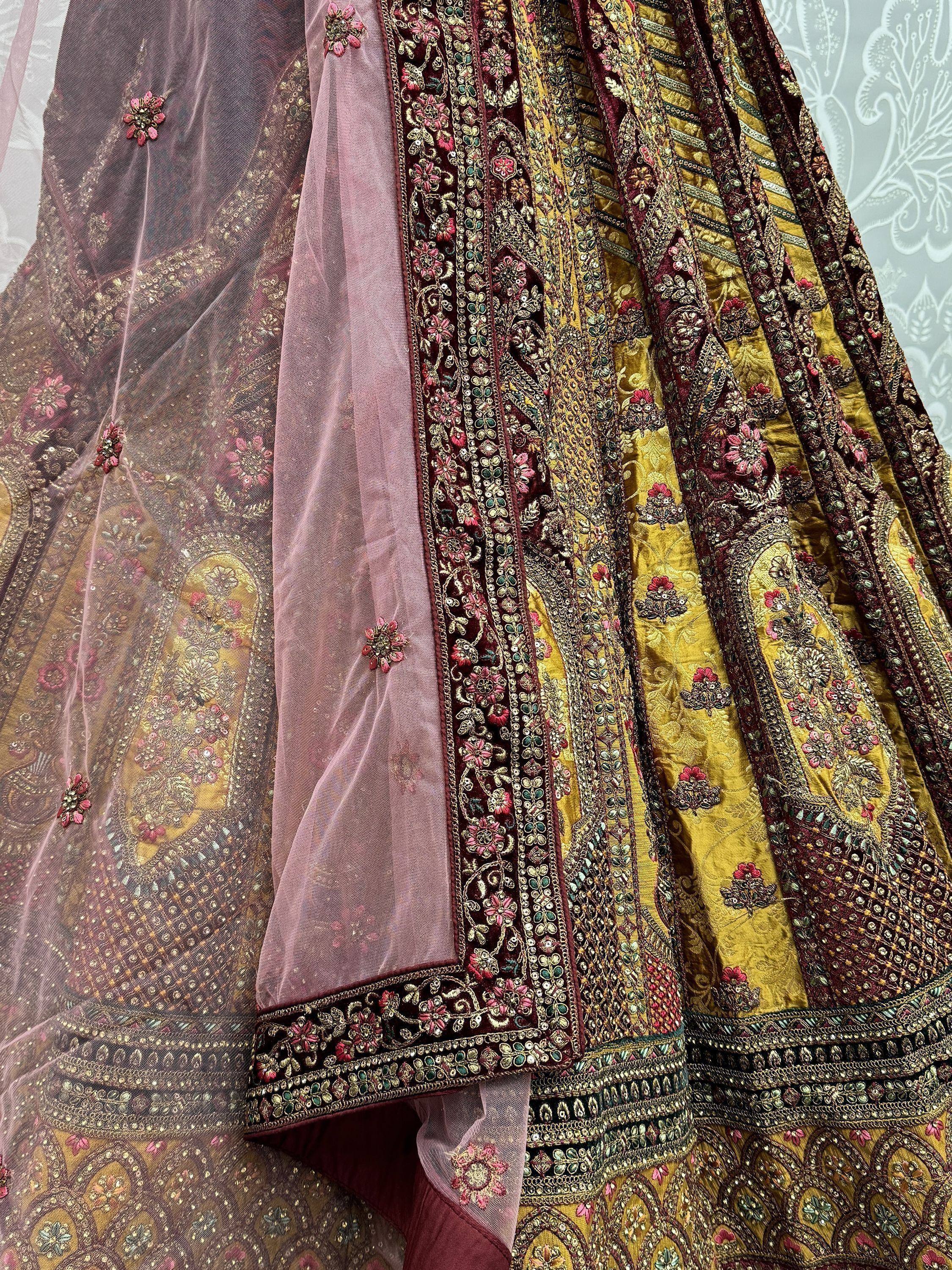 Luxury Indian lehenga choli with heavy embroidery, floral motifs, and sheer dupatta for weddings and festivals