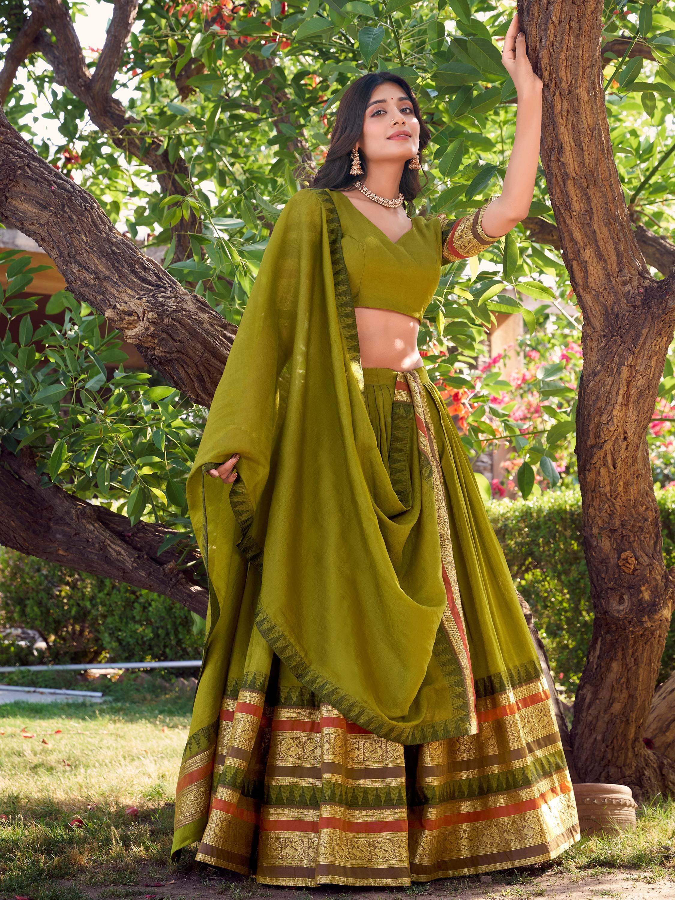 Olive green designer lehenga choli with gold border, perfect for Indian ethnic wear occasions