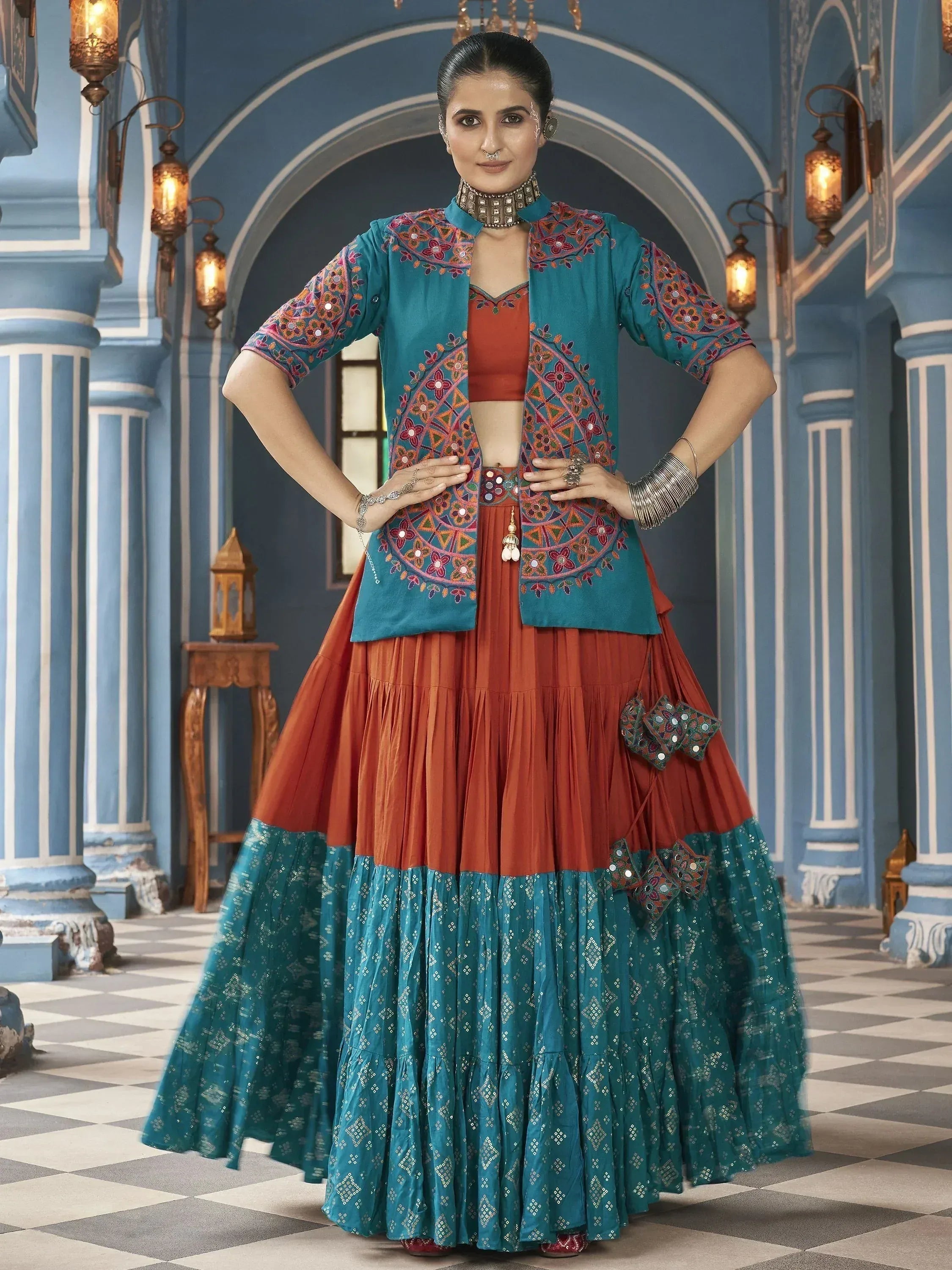 Teal and orange embroidered lehenga choli with mirror work, perfect for Indian ethnic wear