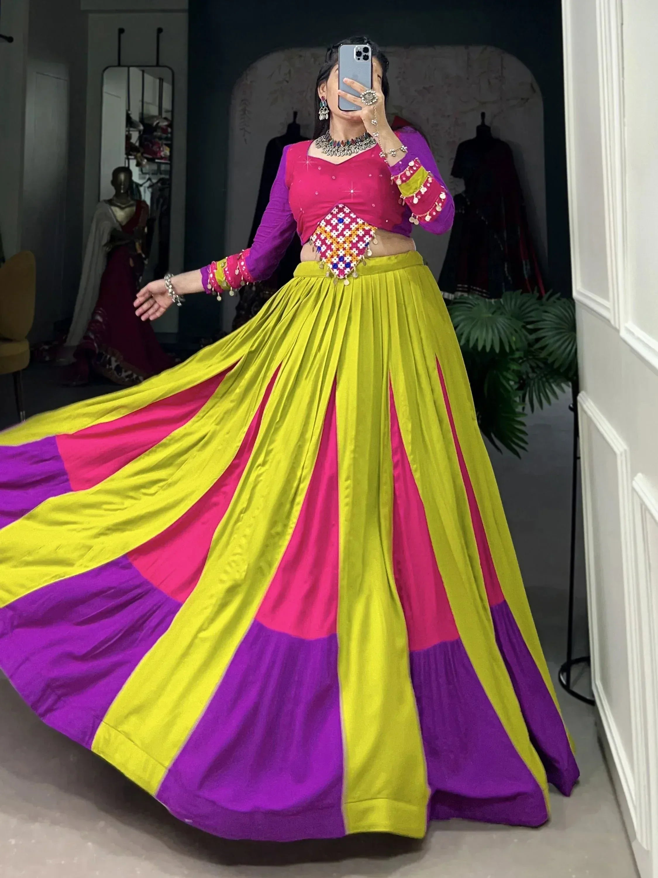 Vibrant multicolor lehenga choli with pink, purple, and yellow panels, perfect for Indian ethnic wear.