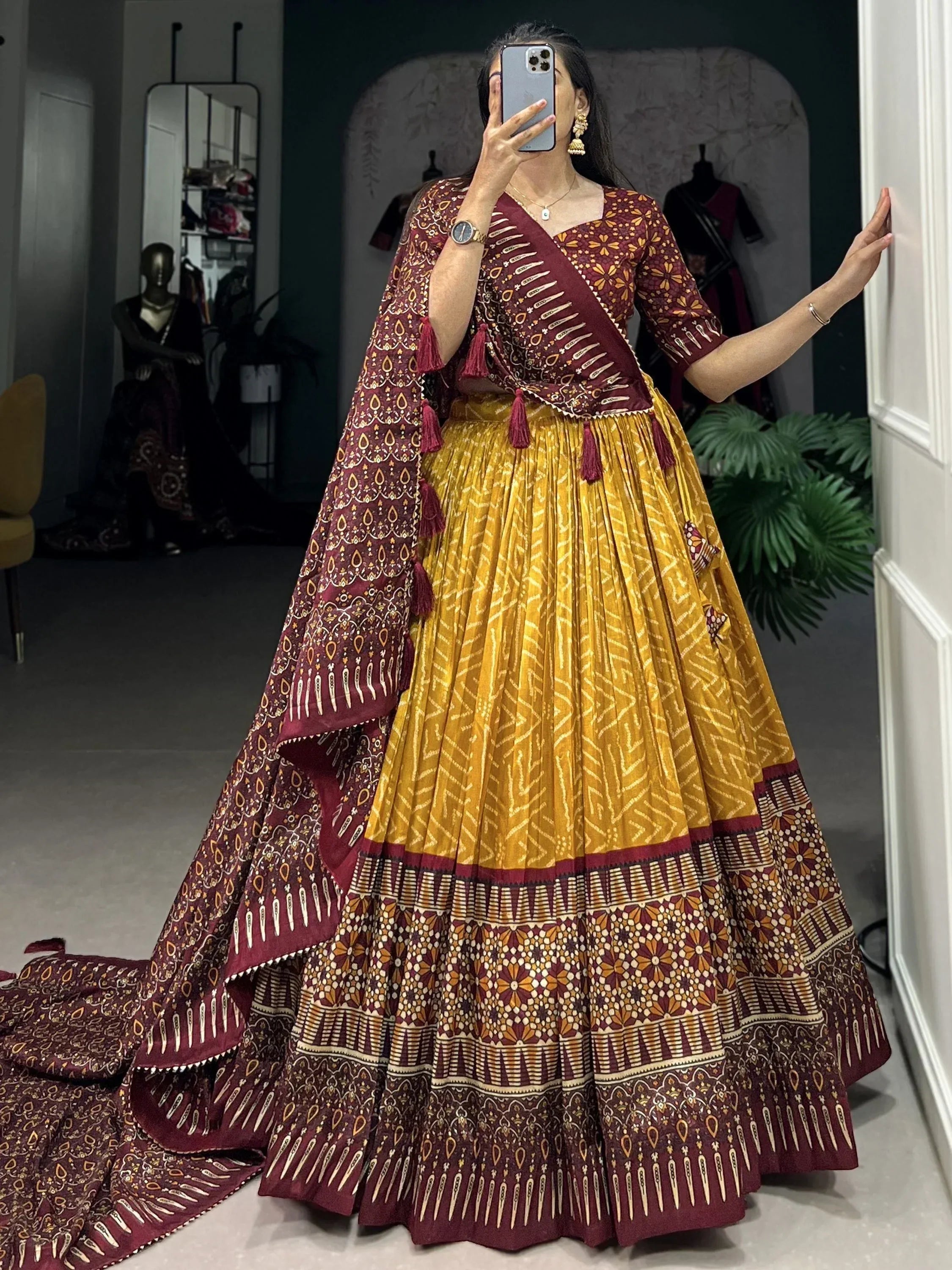 Maroon and mustard printed lehenga choli with tassels, perfect for Indian ethnic wear occasions