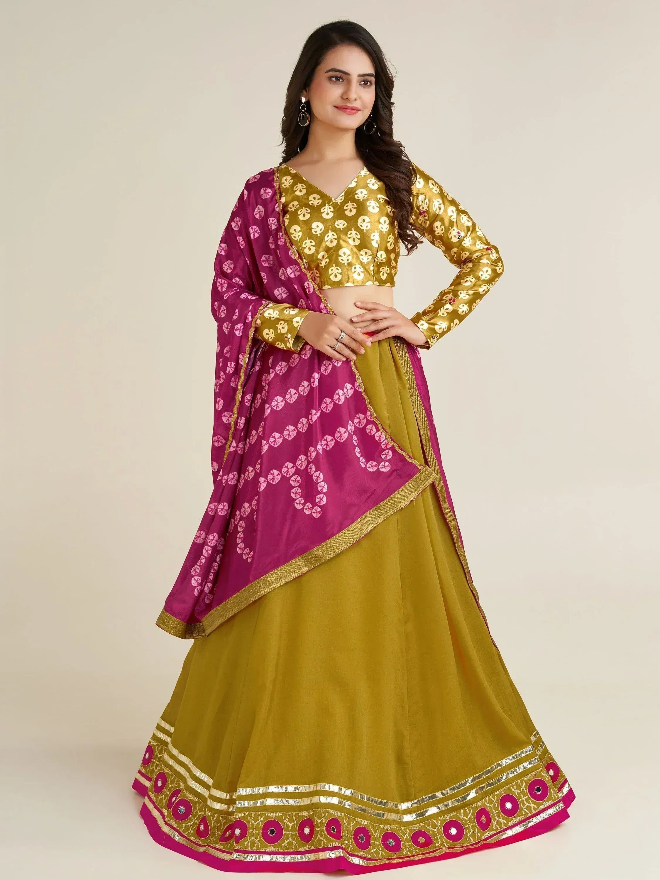 Elegant mustard and magenta lehenga choli with floral print and gold trim, perfect for ethnic occasions.