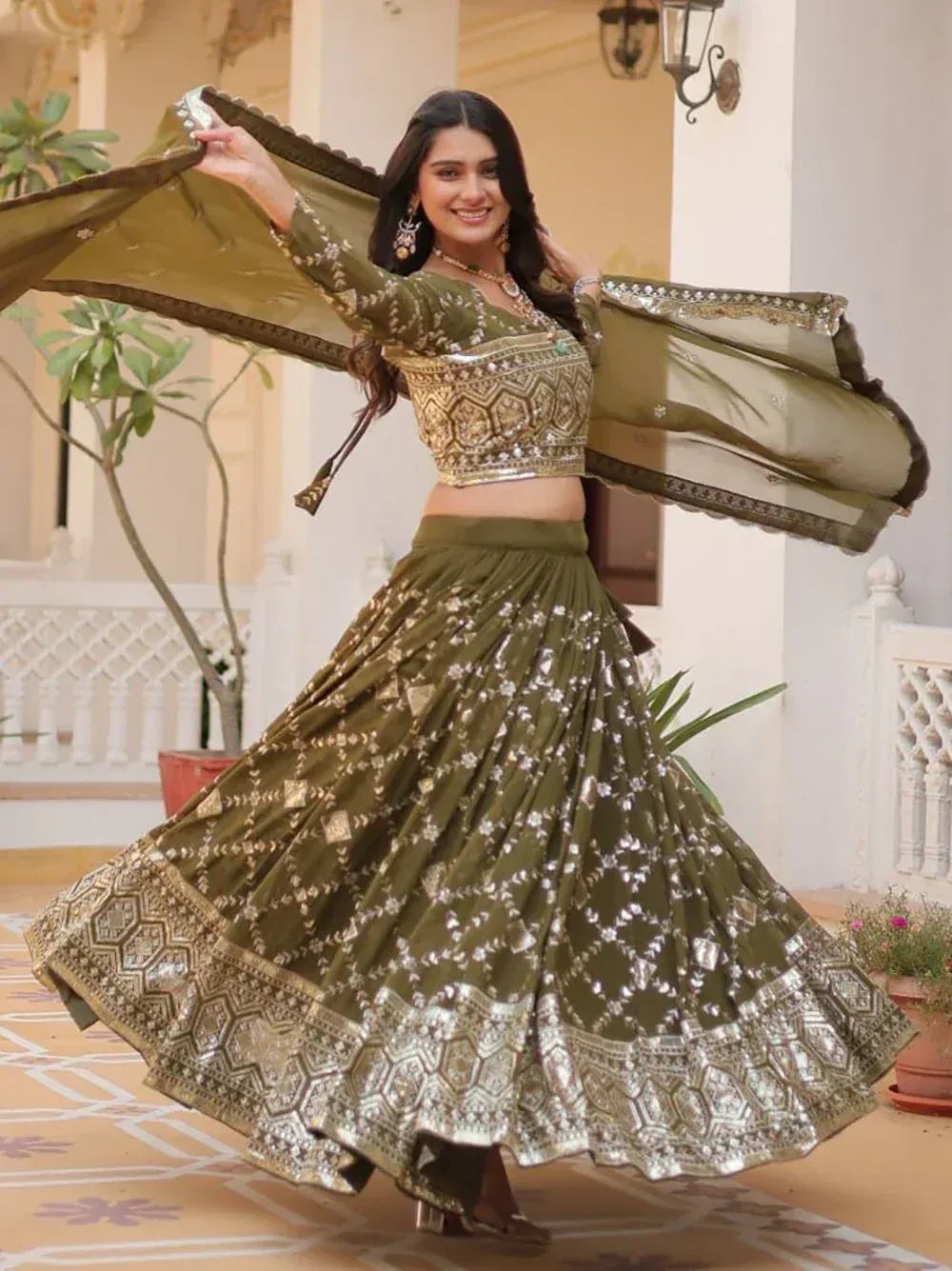 Olive green designer lehenga choli with gold embroidery, perfect for Indian ethnic wear events.