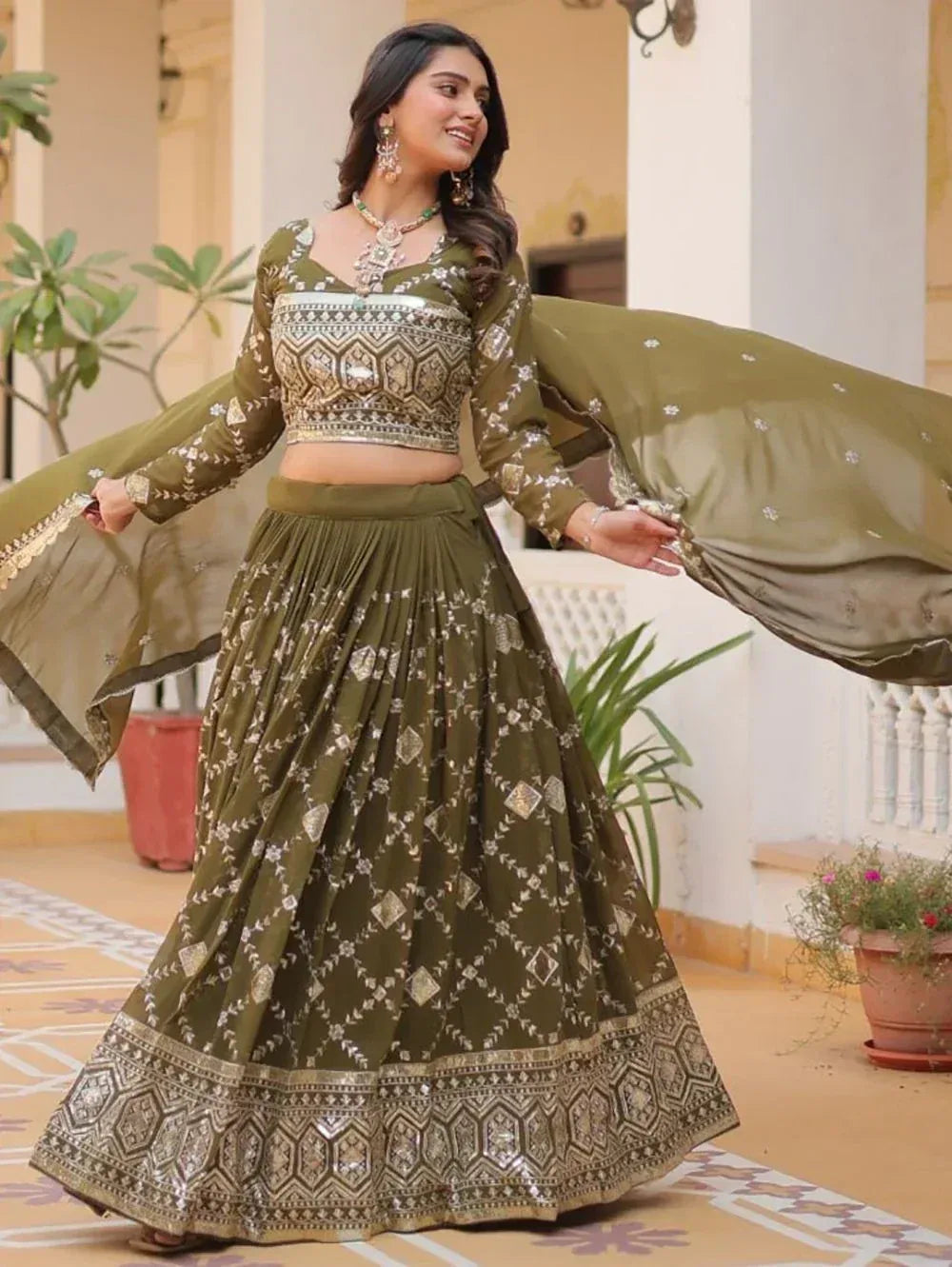 Olive green designer lehenga choli with gold embroidery, perfect for Indian ethnic wear occasions.