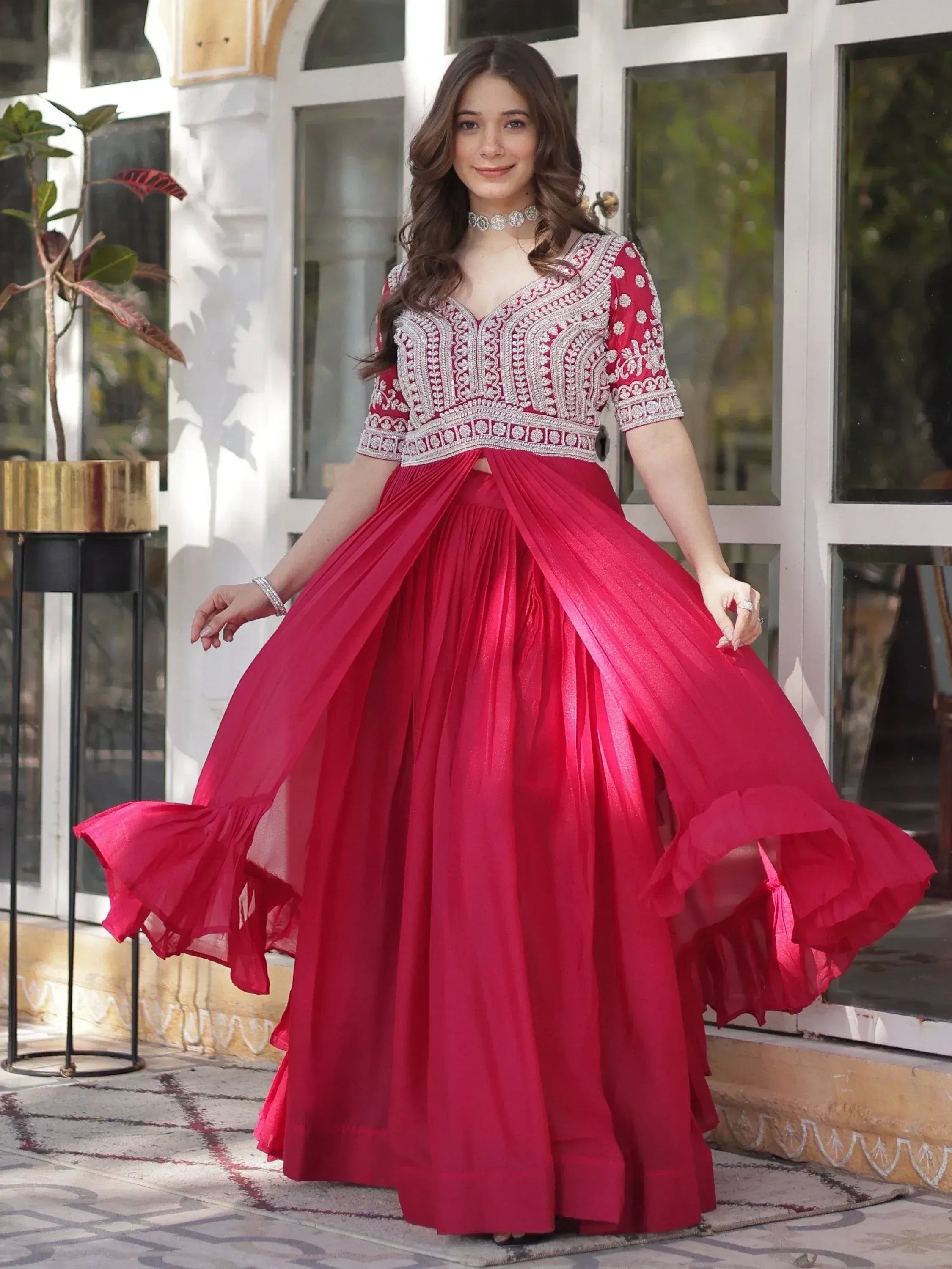 Red embroidered ethnic gown with pleated skirt, perfect for Indian weddings and festive occasions