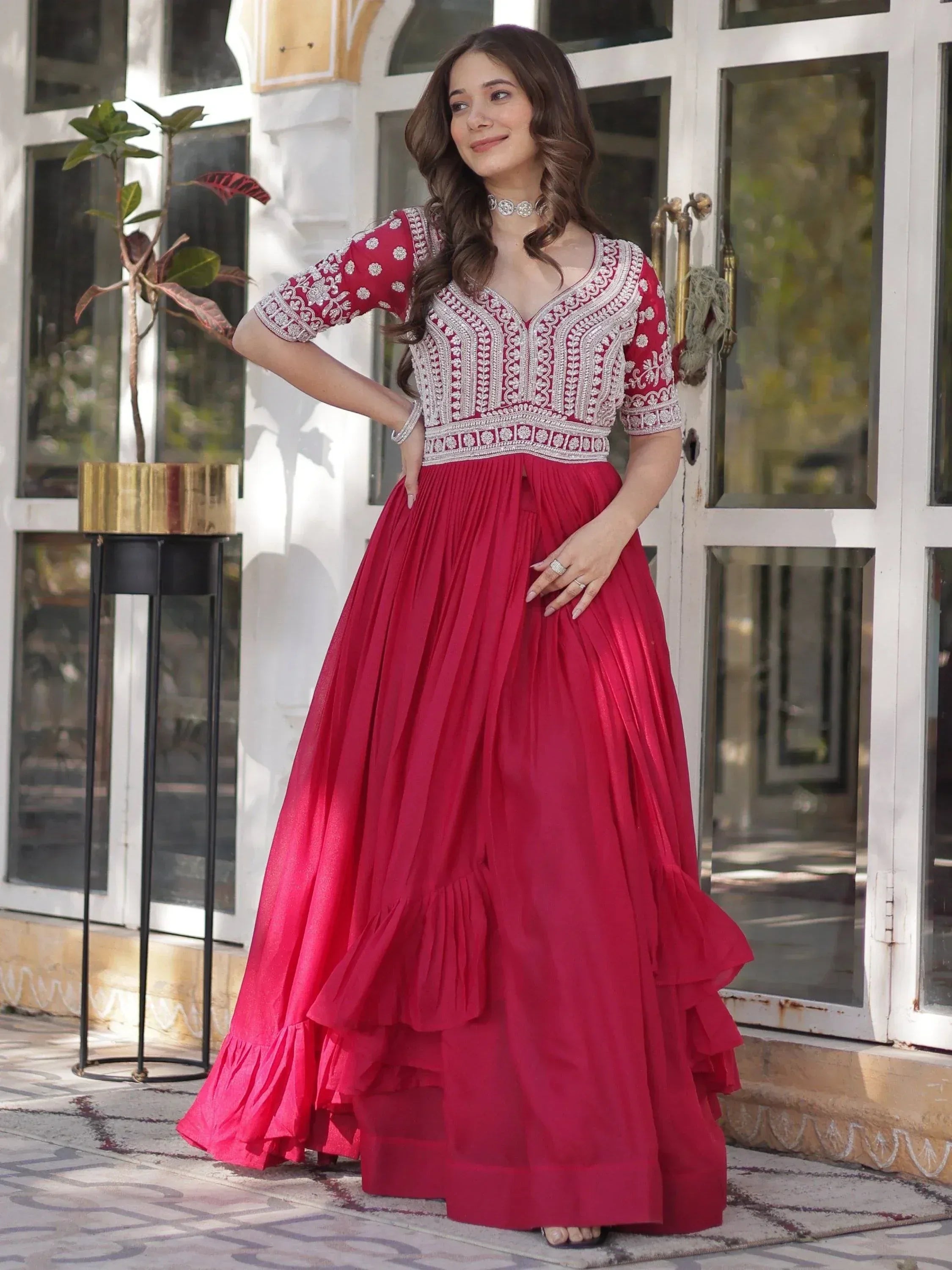 Red embroidered ethnic gown with pleated skirt, perfect for Indian occasions and festive wear.