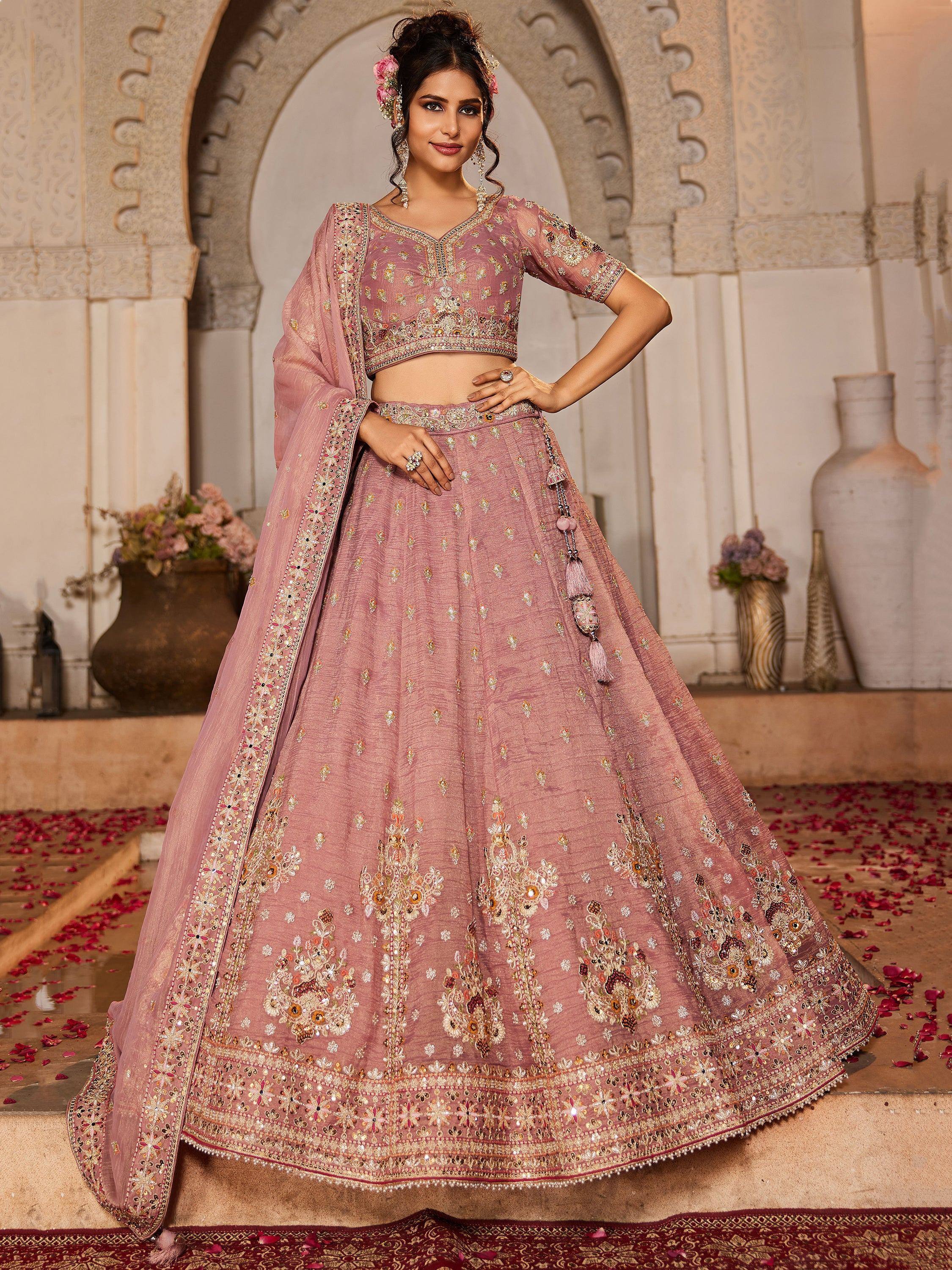 Pink embroidered lehenga choli with floral motifs, perfect for Indian weddings and festive occasions
