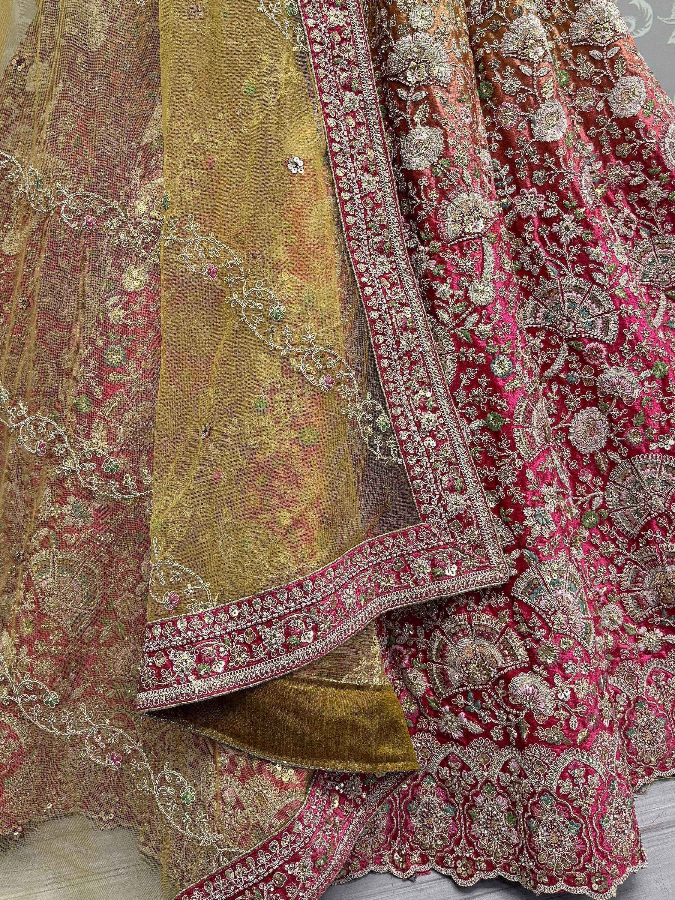 Luxury Indian lehenga choli with heavy floral embroidery, gold net dupatta, and velvet blouse for weddings