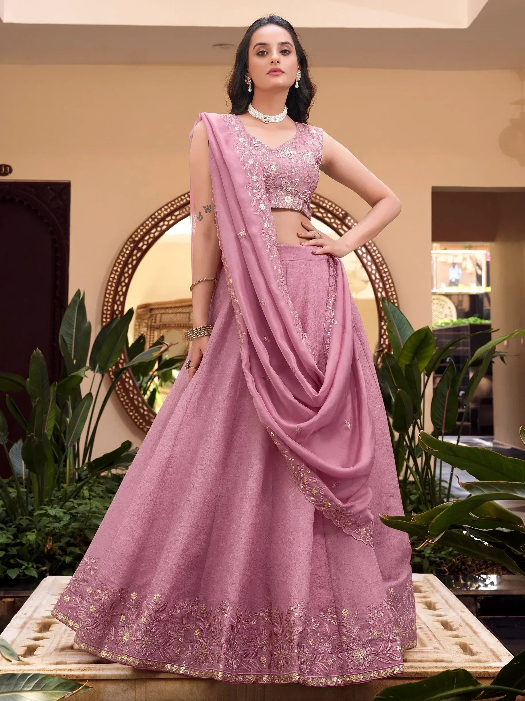 Pink embroidered lehenga choli with floral detailing, perfect for Indian ethnic wear occasions