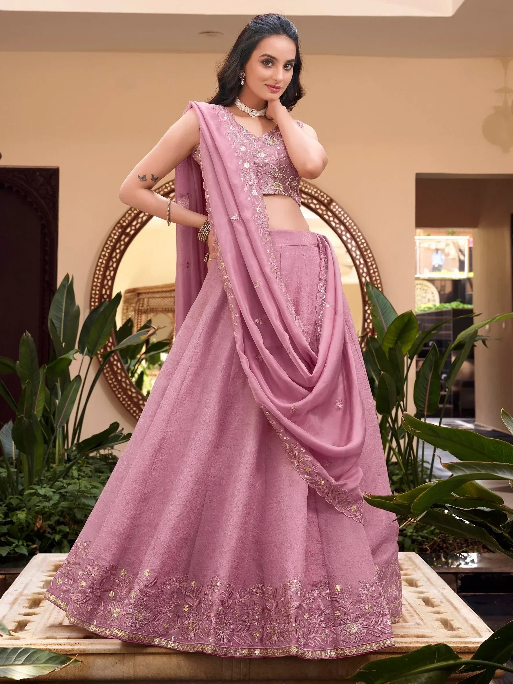 Pink embroidered lehenga choli with floral detailing, perfect for Indian ethnic wear and festive occasions.