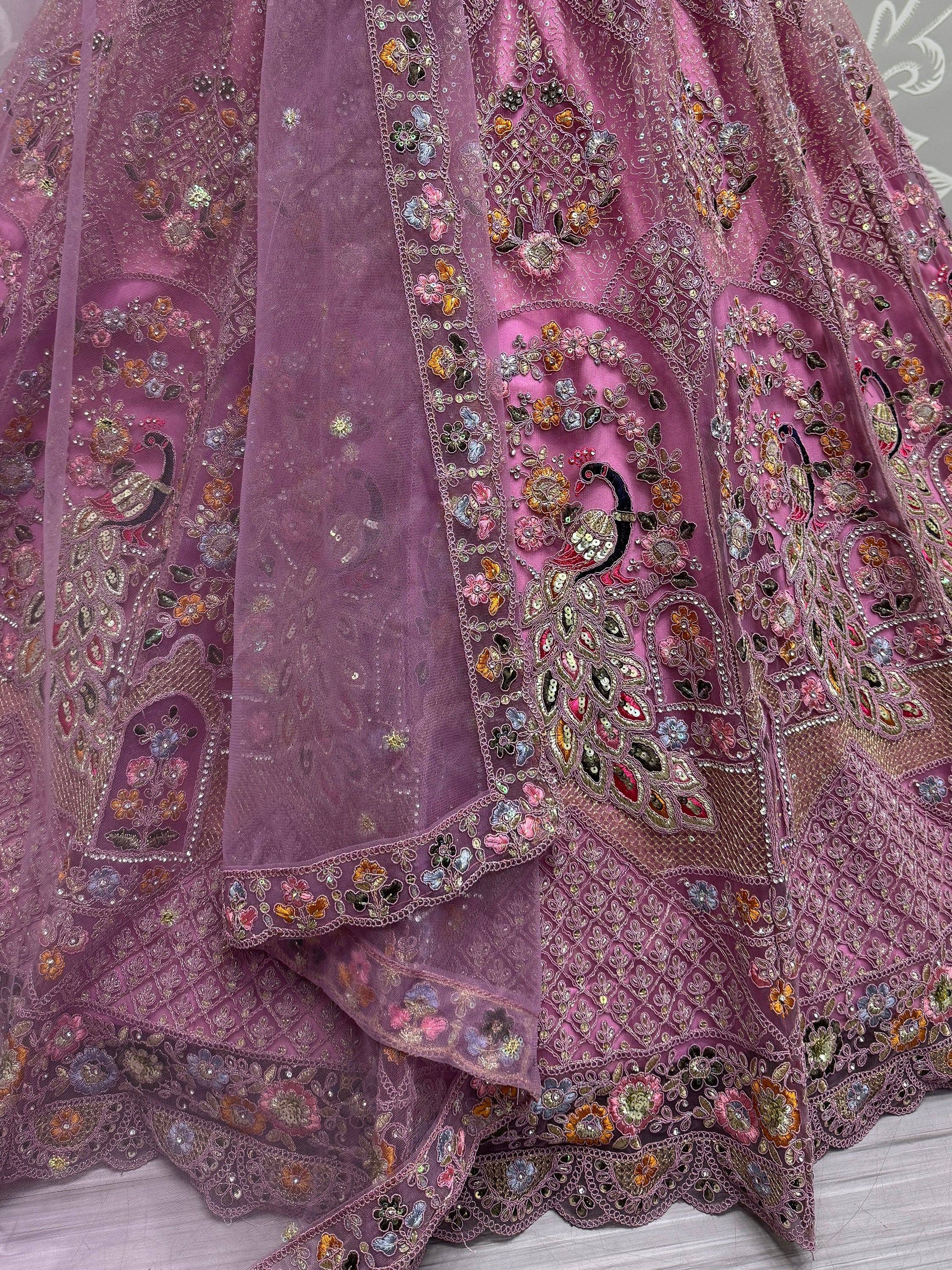 Purple embroidered lehenga with peacock and floral motifs, perfect for Indian ethnic wear occasions.