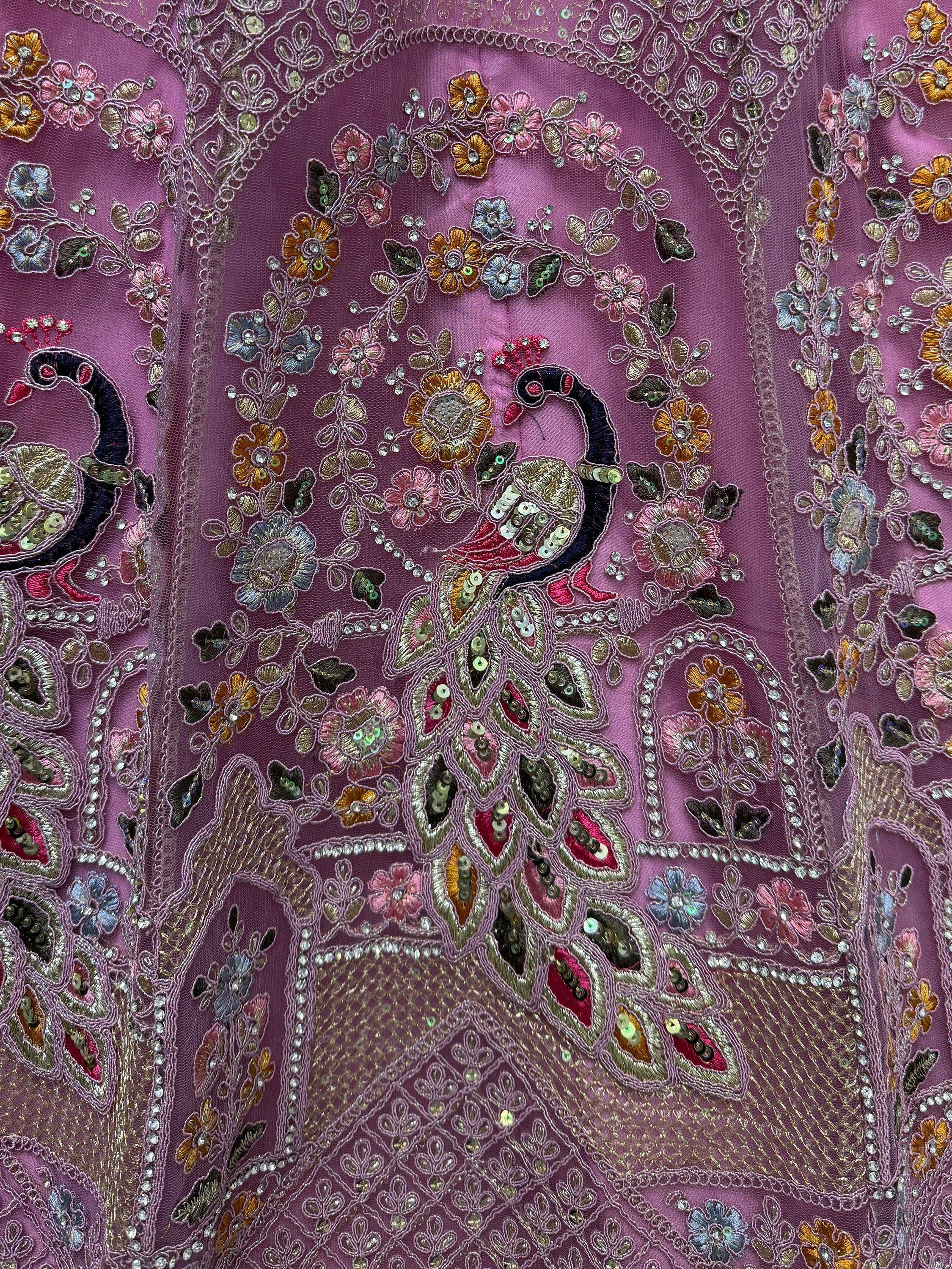 Purple ethnic wear with peacock and floral embroidery, sequins, and beadwork for festive occasions