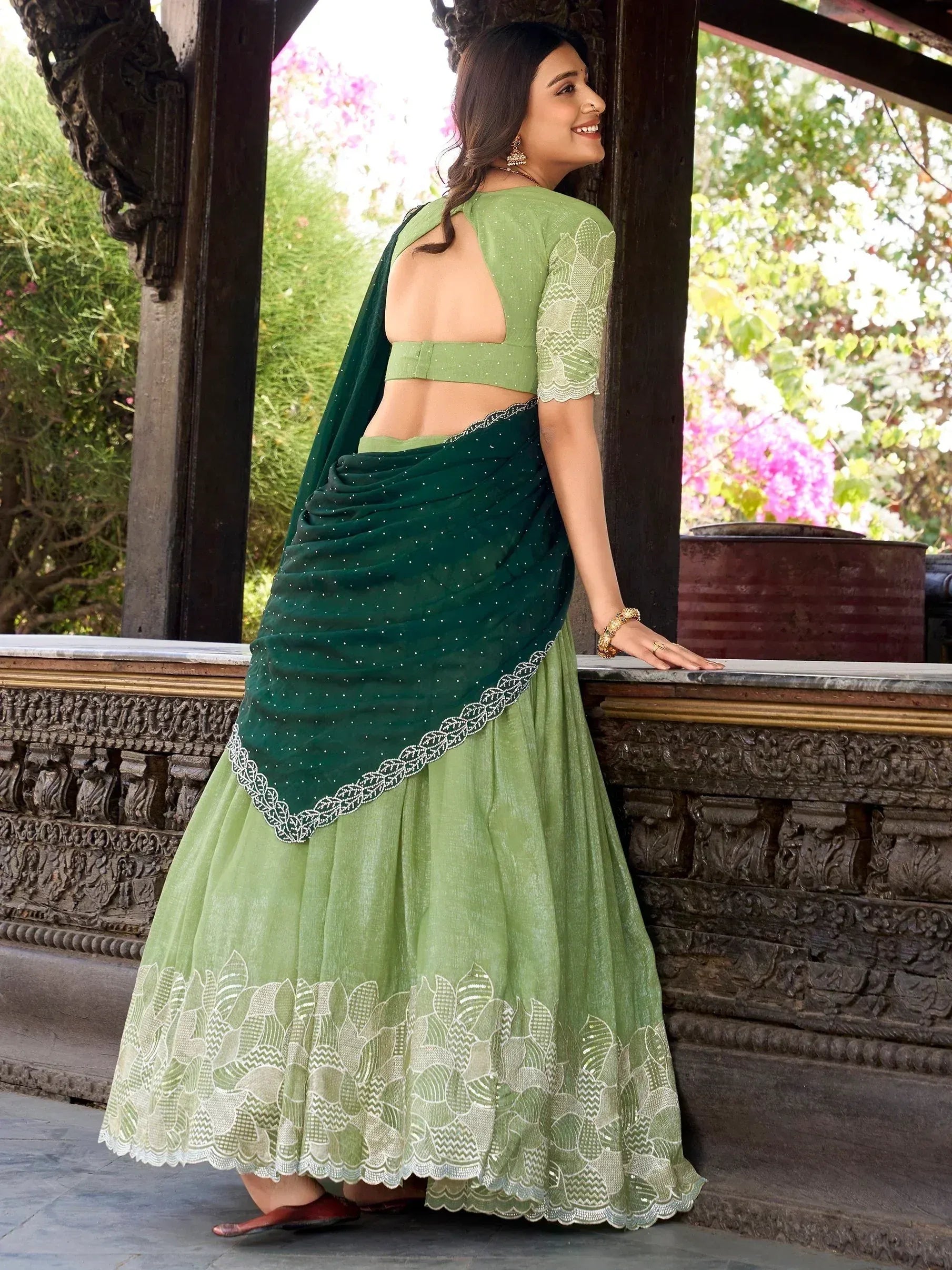 Green designer lehenga choli with lace detailing, perfect for Indian ethnic wear occasions