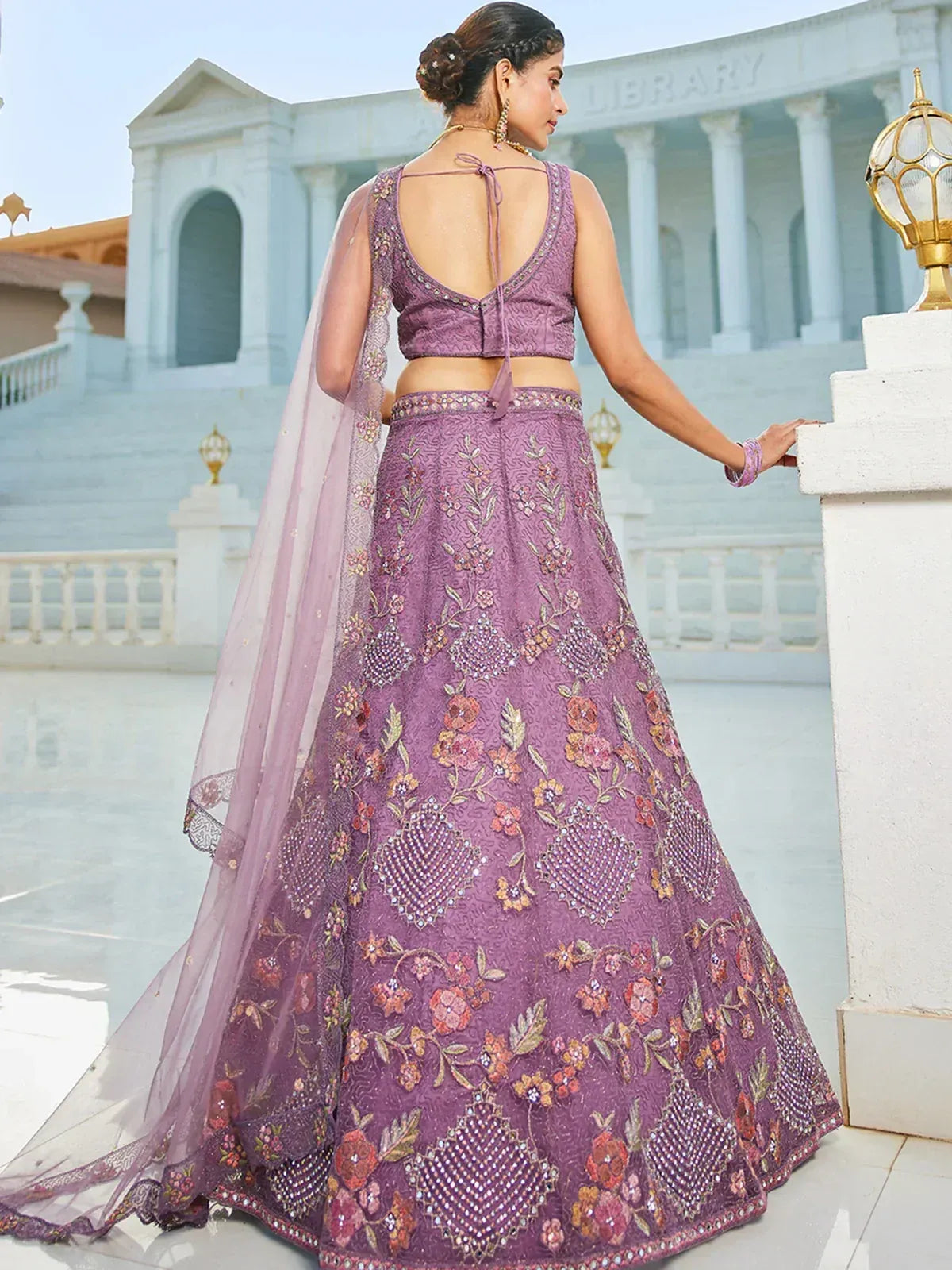 Purple floral embroidered lehenga choli with back tie blouse and sheer dupatta, perfect for Indian ethnic occasions