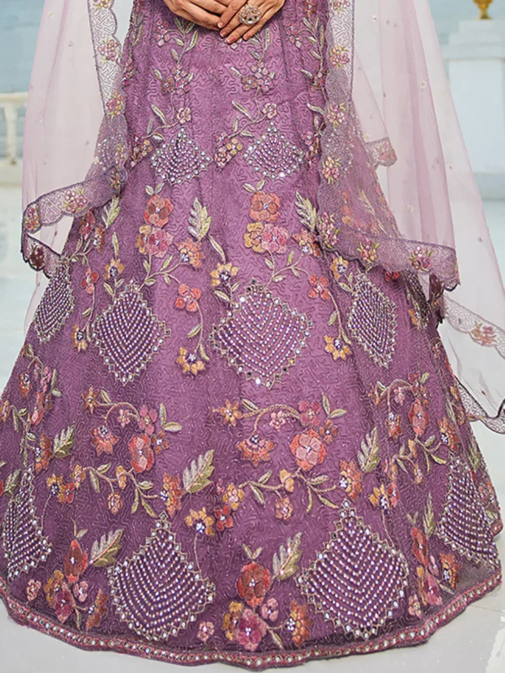 Purple embroidered lehenga with floral motifs and sequin work, perfect for Indian ethnic wear