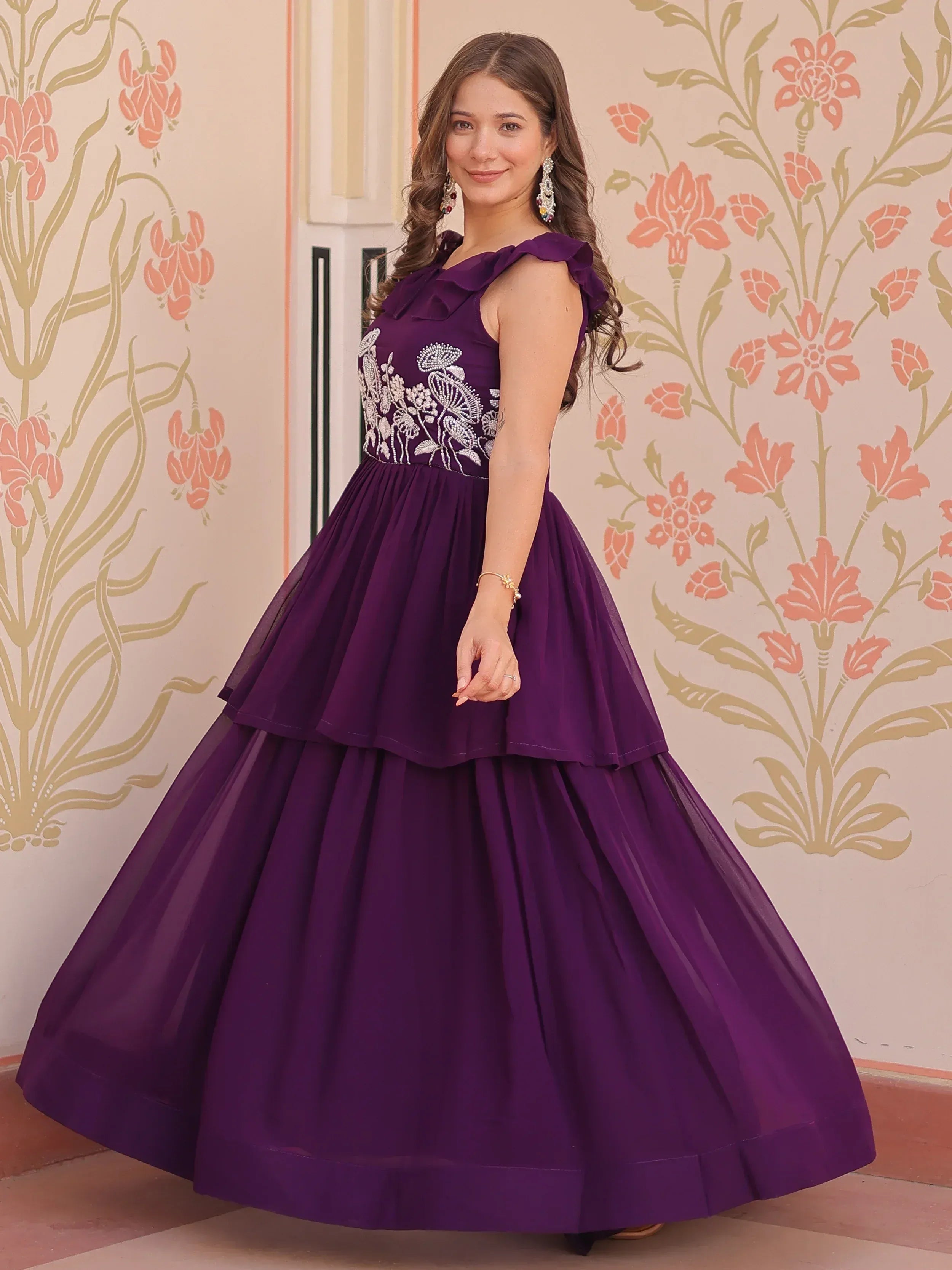 Purple ethnic gown with floral embroidery and ruffle sleeves, perfect for Indian celebrations