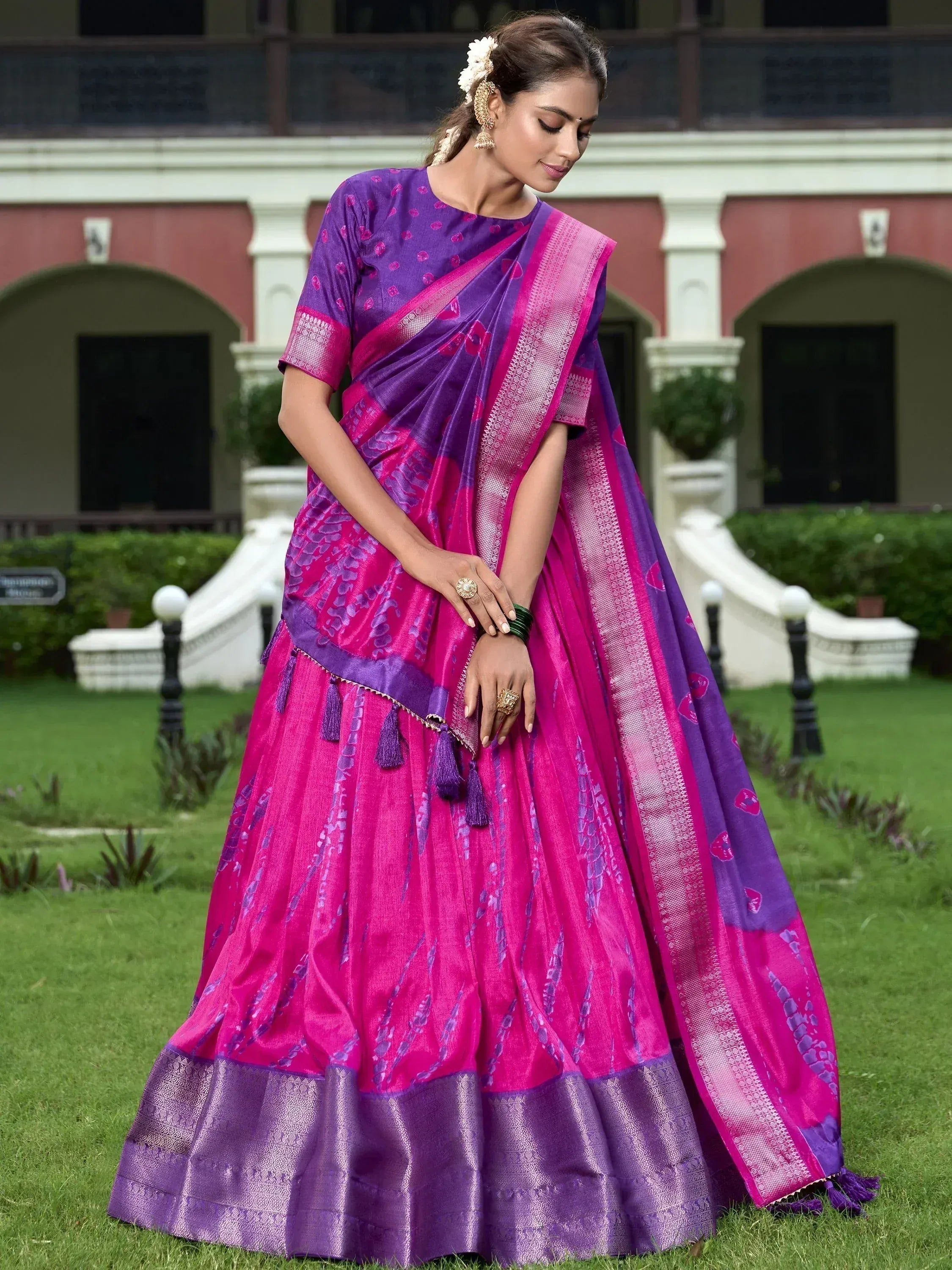 Purple and pink designer lehenga choli with floral print, tassels, and woven border, perfect for Indian ethnic wear