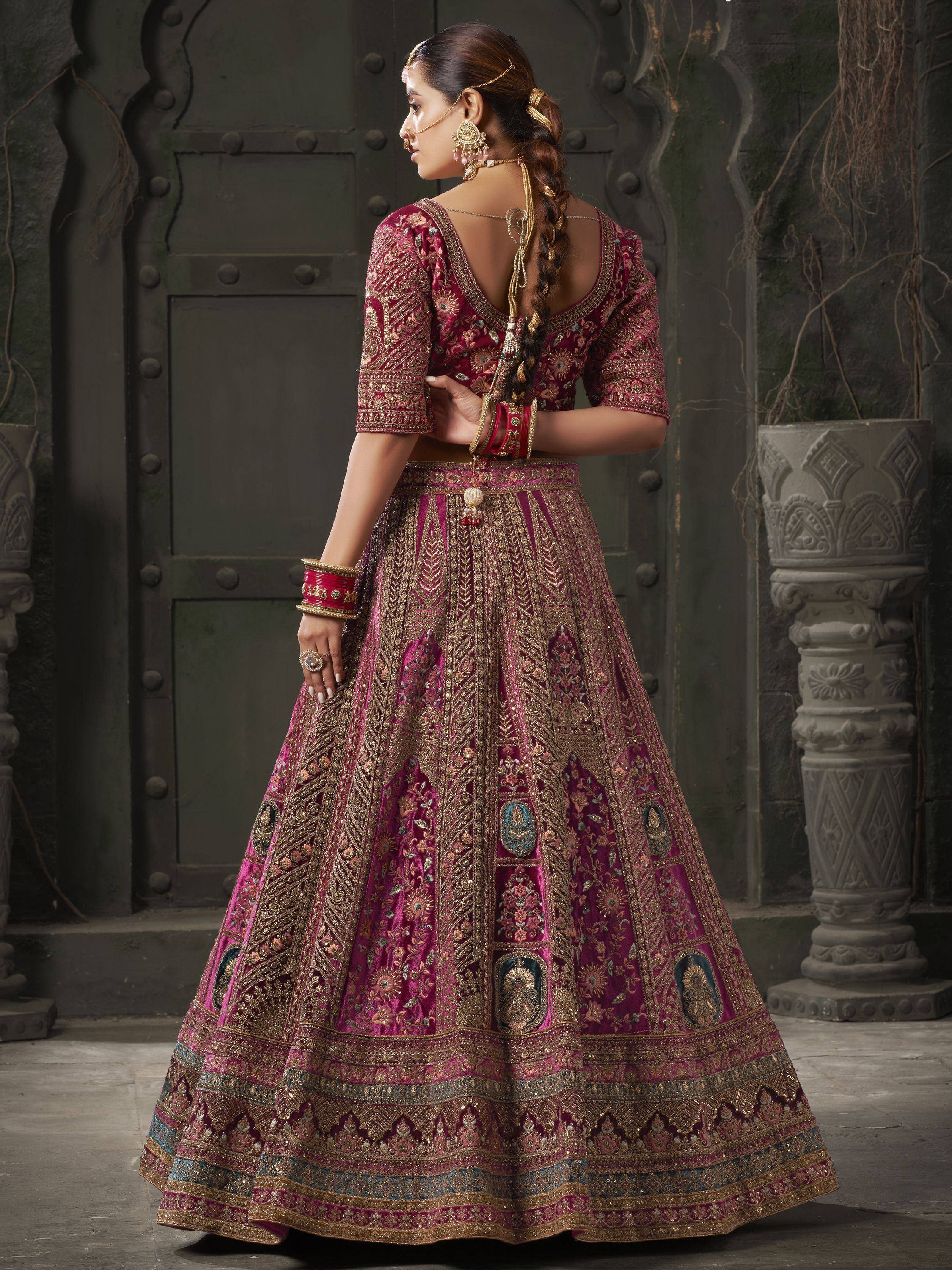 Elegant maroon lehenga choli with gold embroidery, perfect for Indian weddings and festive occasions.