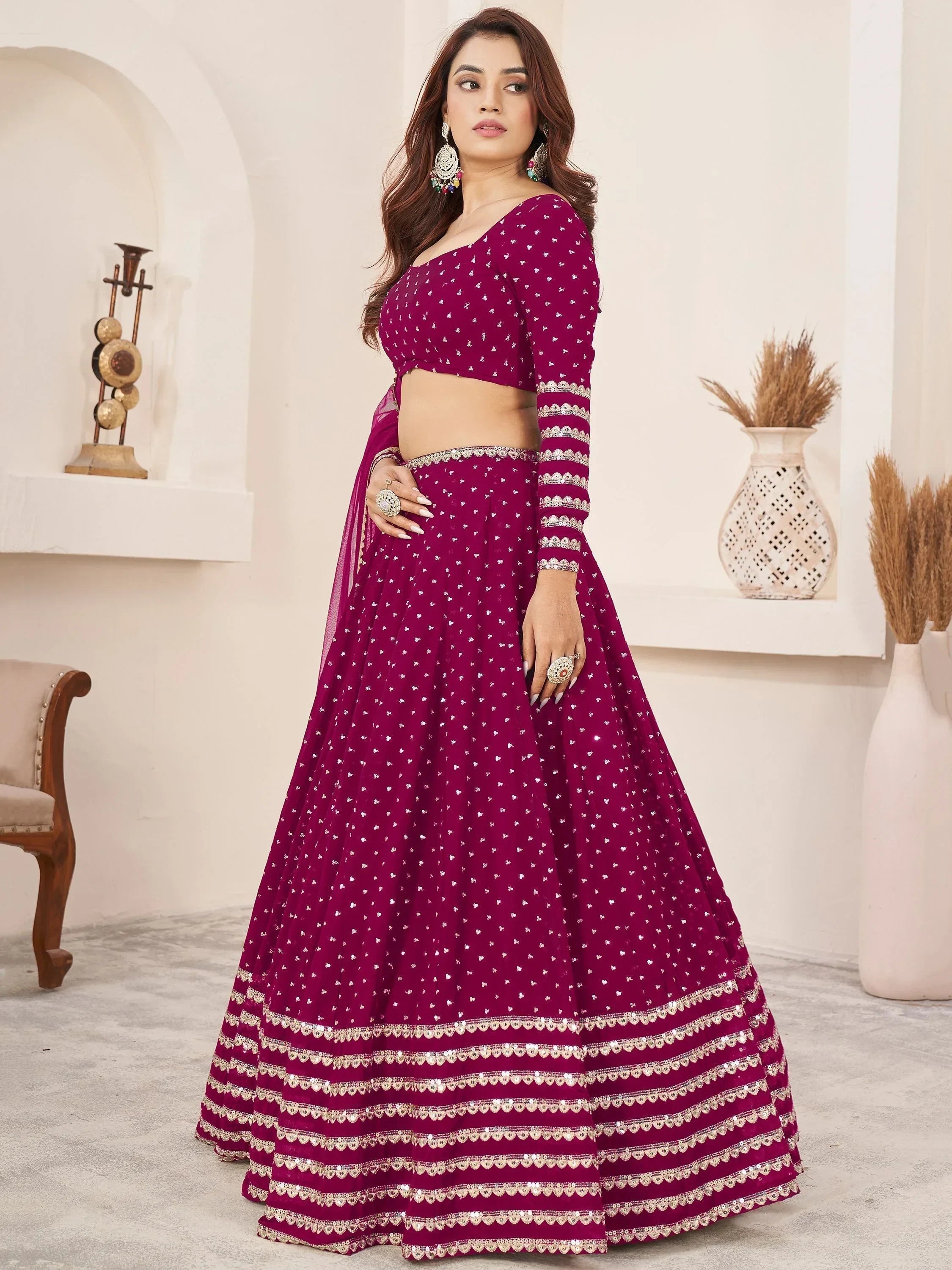 Burgundy lehenga choli with silver embroidery and sequin detailing, perfect for Indian ethnic wear occasions.