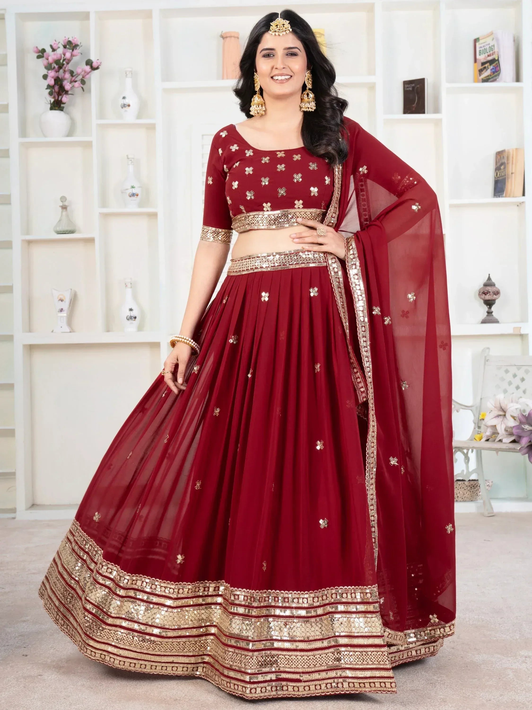 Maroon designer lehenga choli with gold embroidery and sequin work, perfect for Indian ethnic occasions