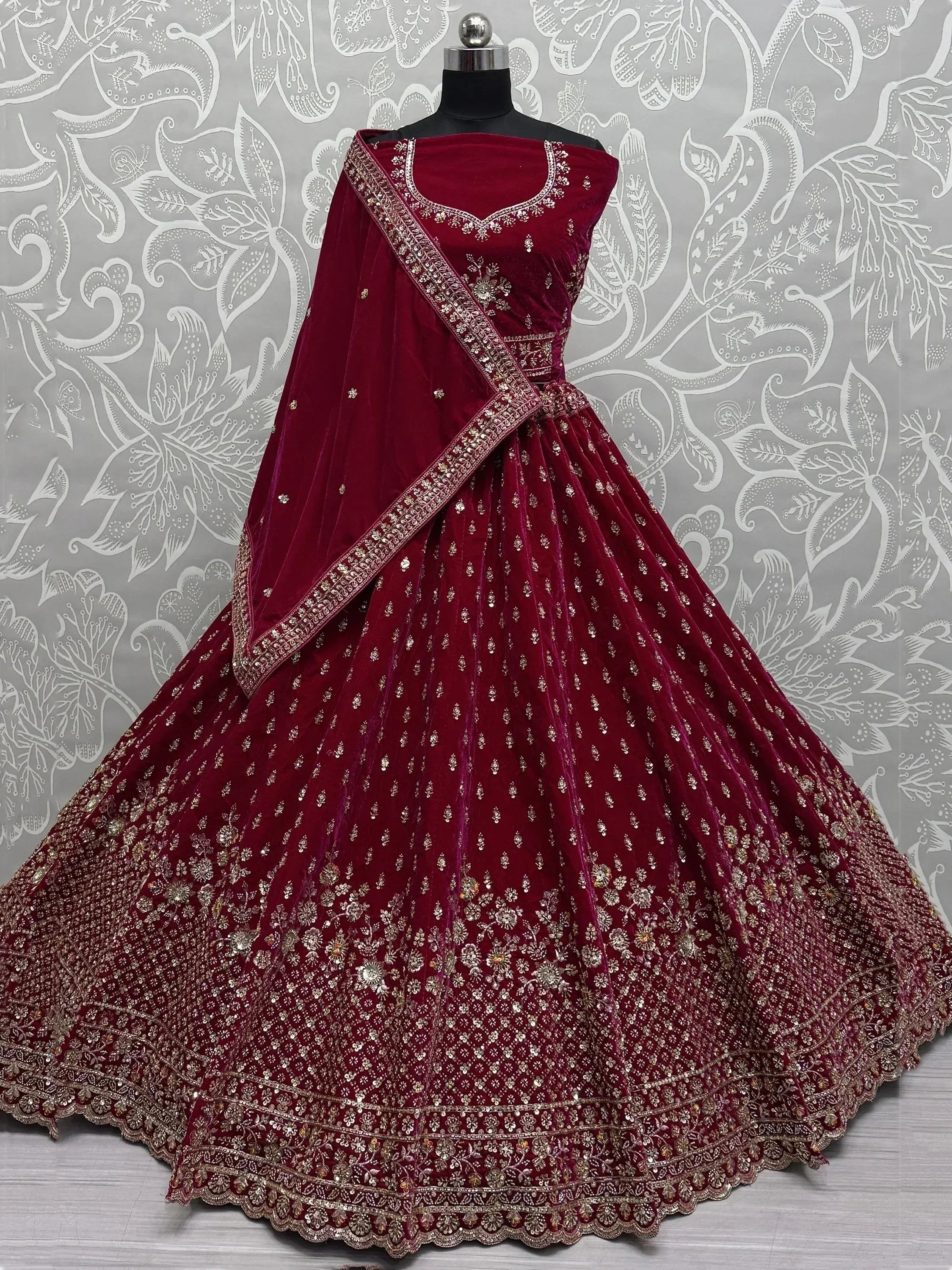 Burgundy velvet lehenga choli with gold embroidery, designer Indian ethnic wear for weddings