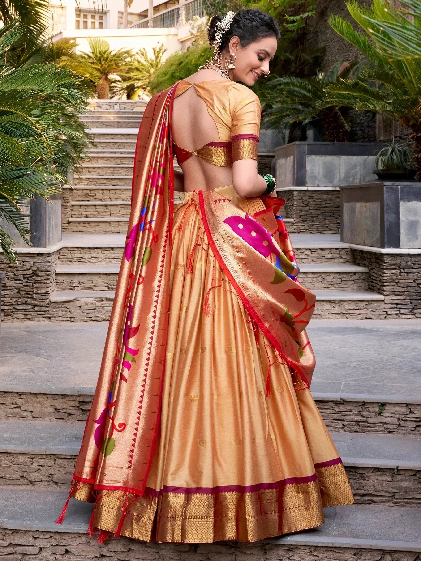 Golden designer lehenga choli with floral dupatta, perfect for Indian ethnic wear and festive occasions.