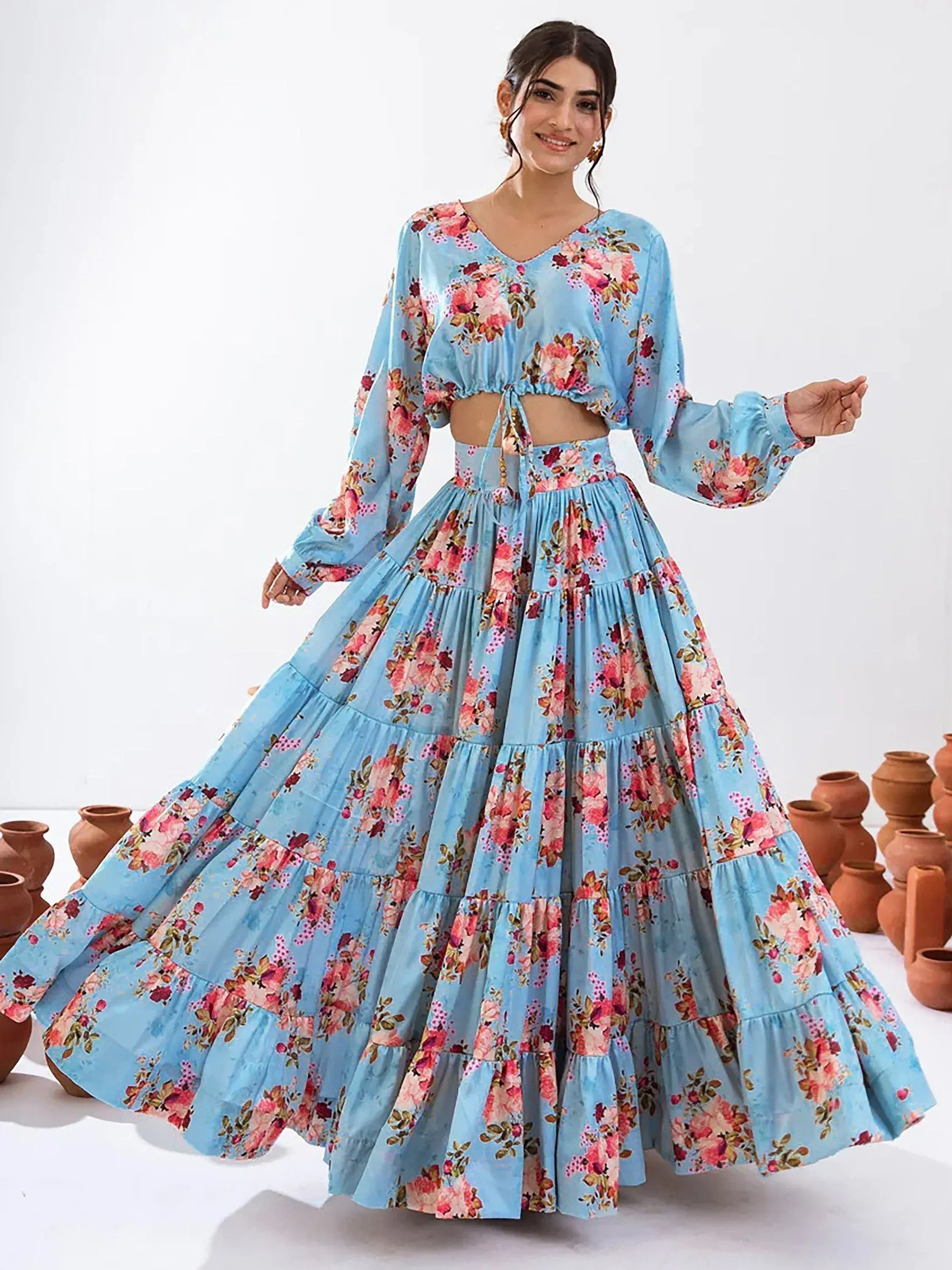 Blue floral ethnic gown with tiered skirt and long sleeves, perfect for festive occasions
