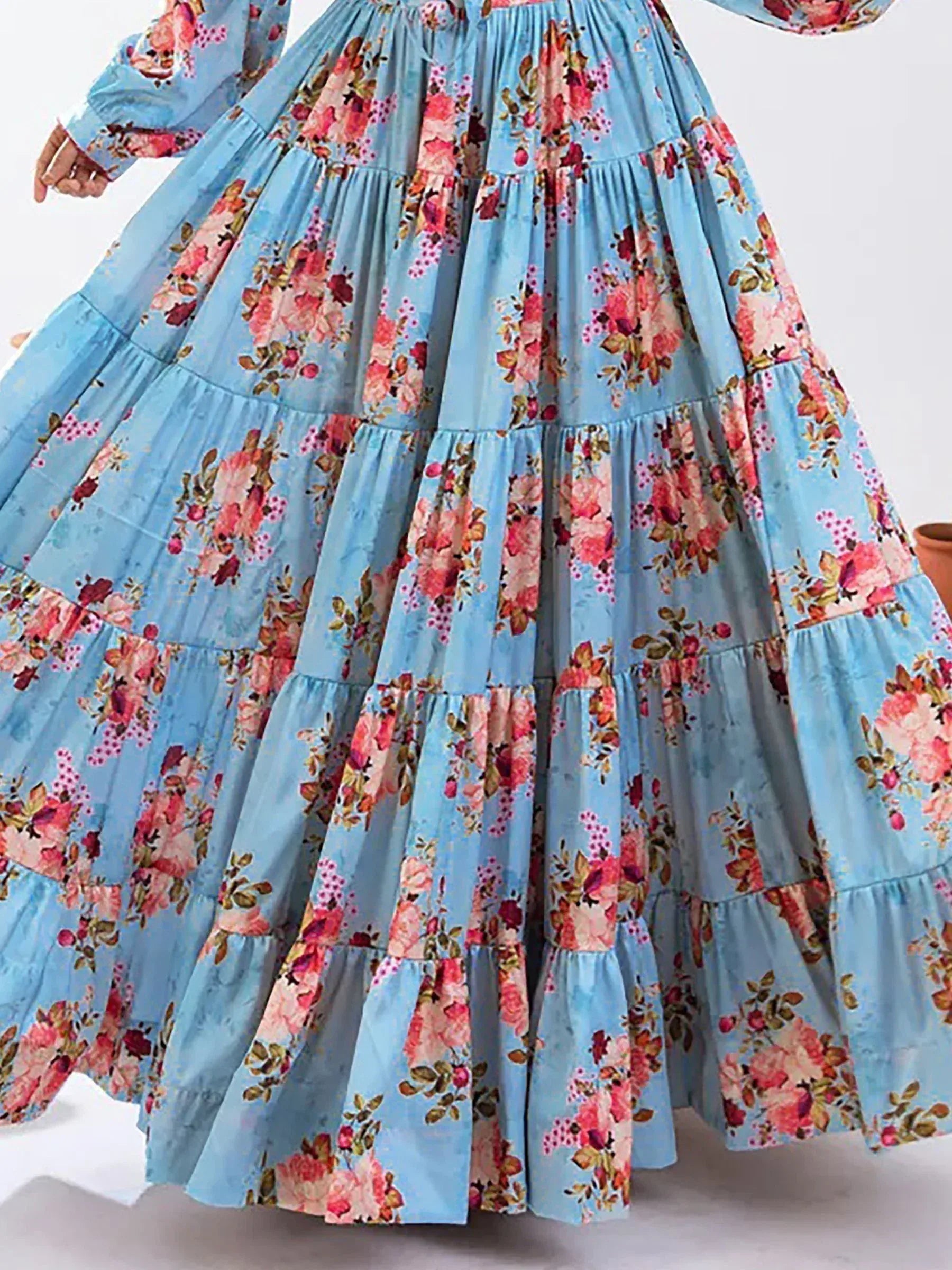 Blue floral tiered ethnic gown with long sleeves, perfect for festive occasions and Indian wear