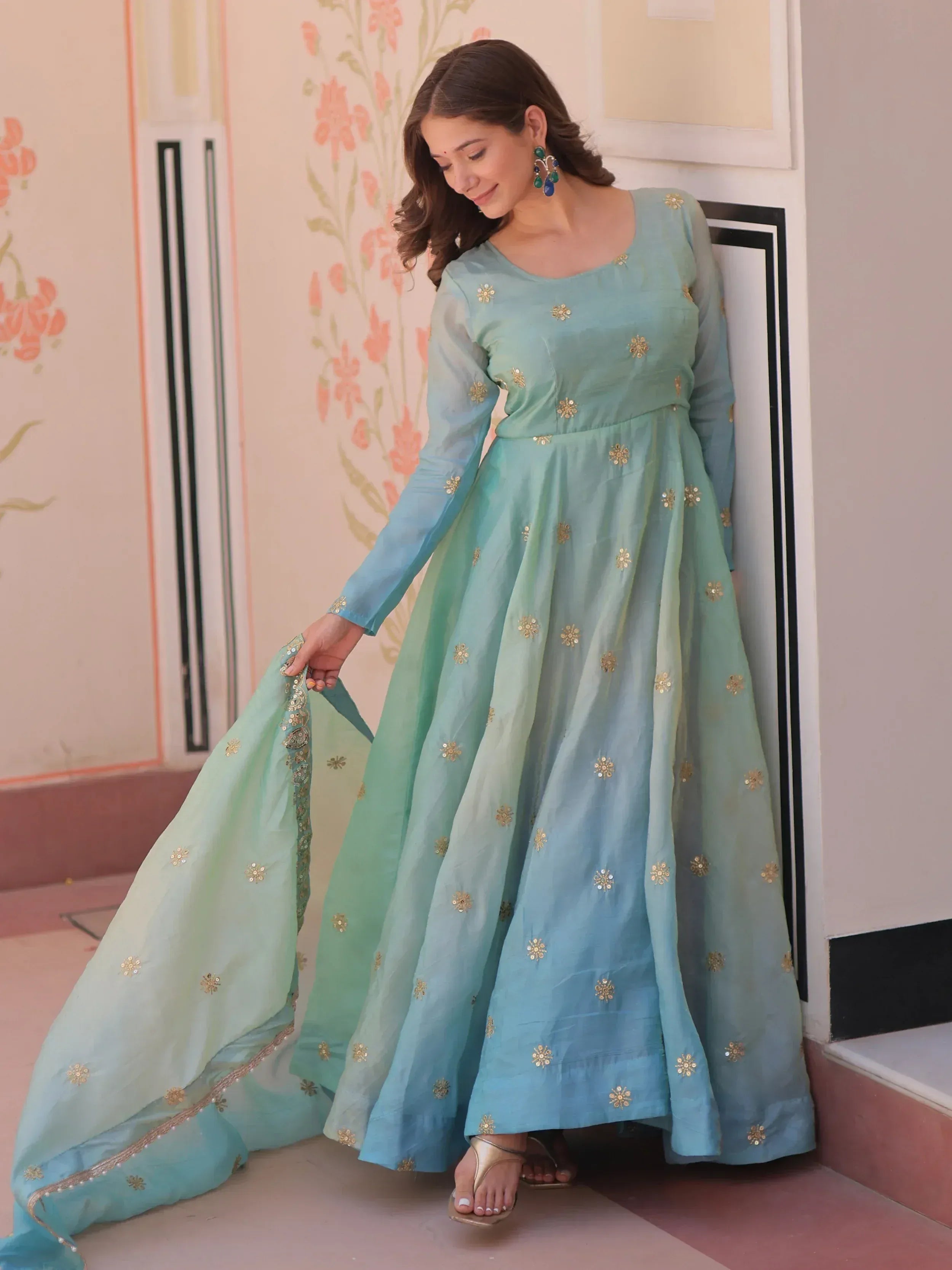 Mint green ethnic anarkali gown with gold floral embroidery, perfect for Indian festive occasions
