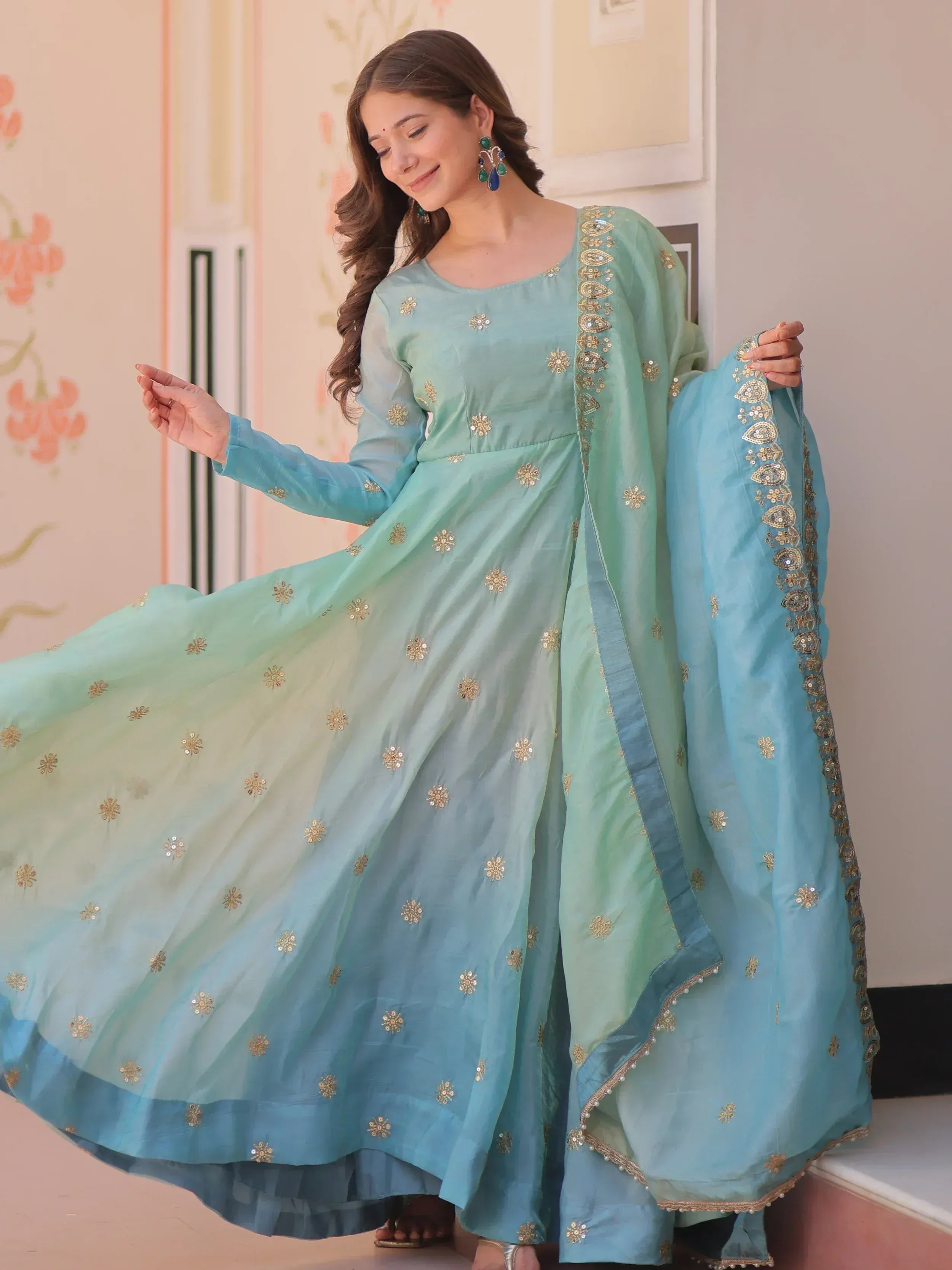 Mint blue ethnic anarkali gown with gold embroidery and dupatta, perfect for Indian occasions