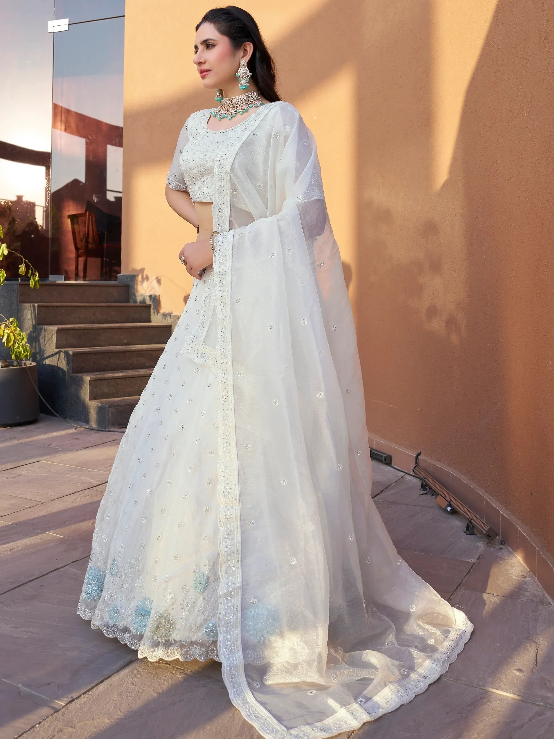 White embroidered lehenga choli with sheer dupatta, perfect for Indian weddings and festive occasions