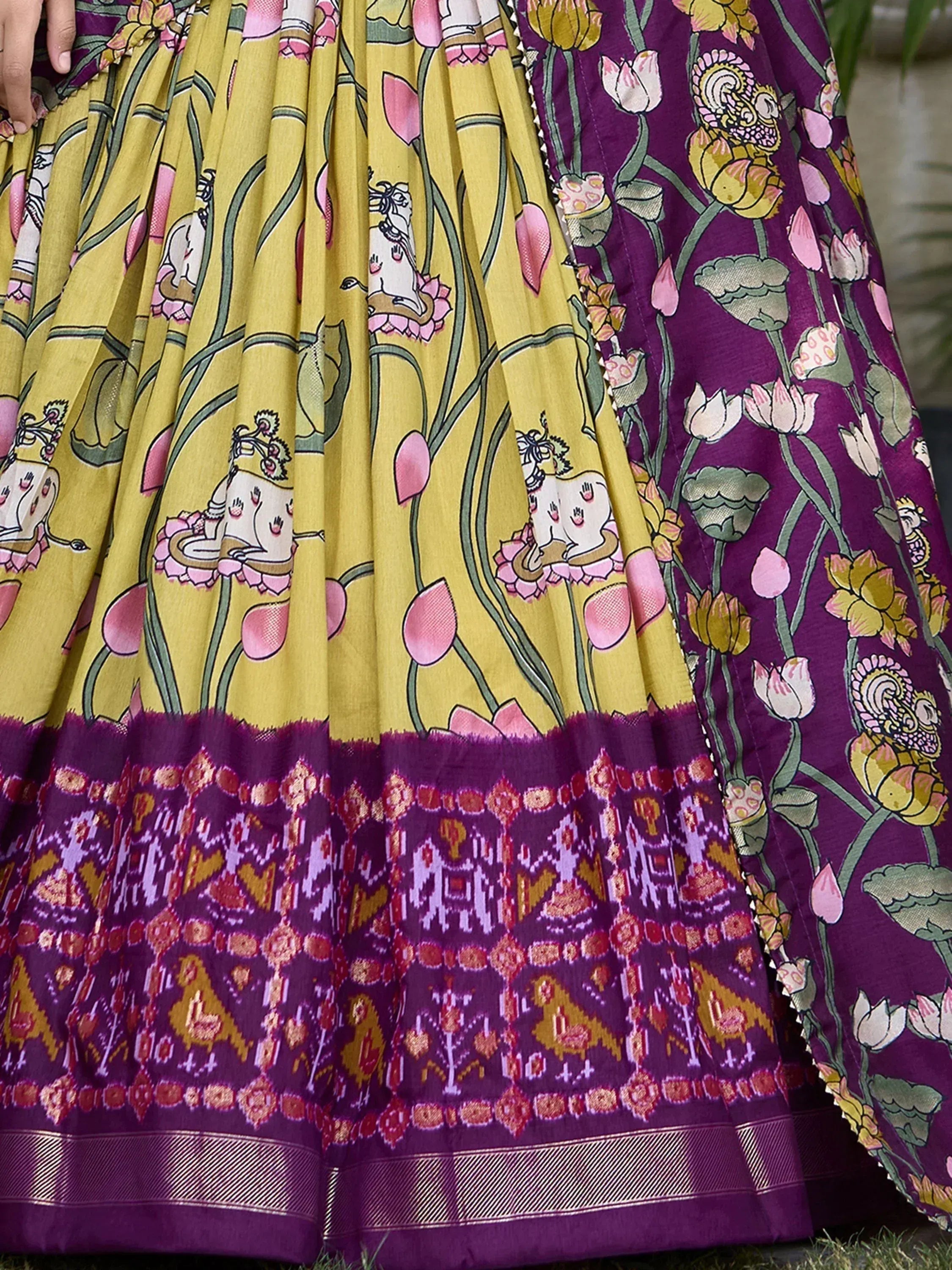 Yellow and purple floral printed lehenga with Ganesha motifs and ikat border, Indian ethnic wear