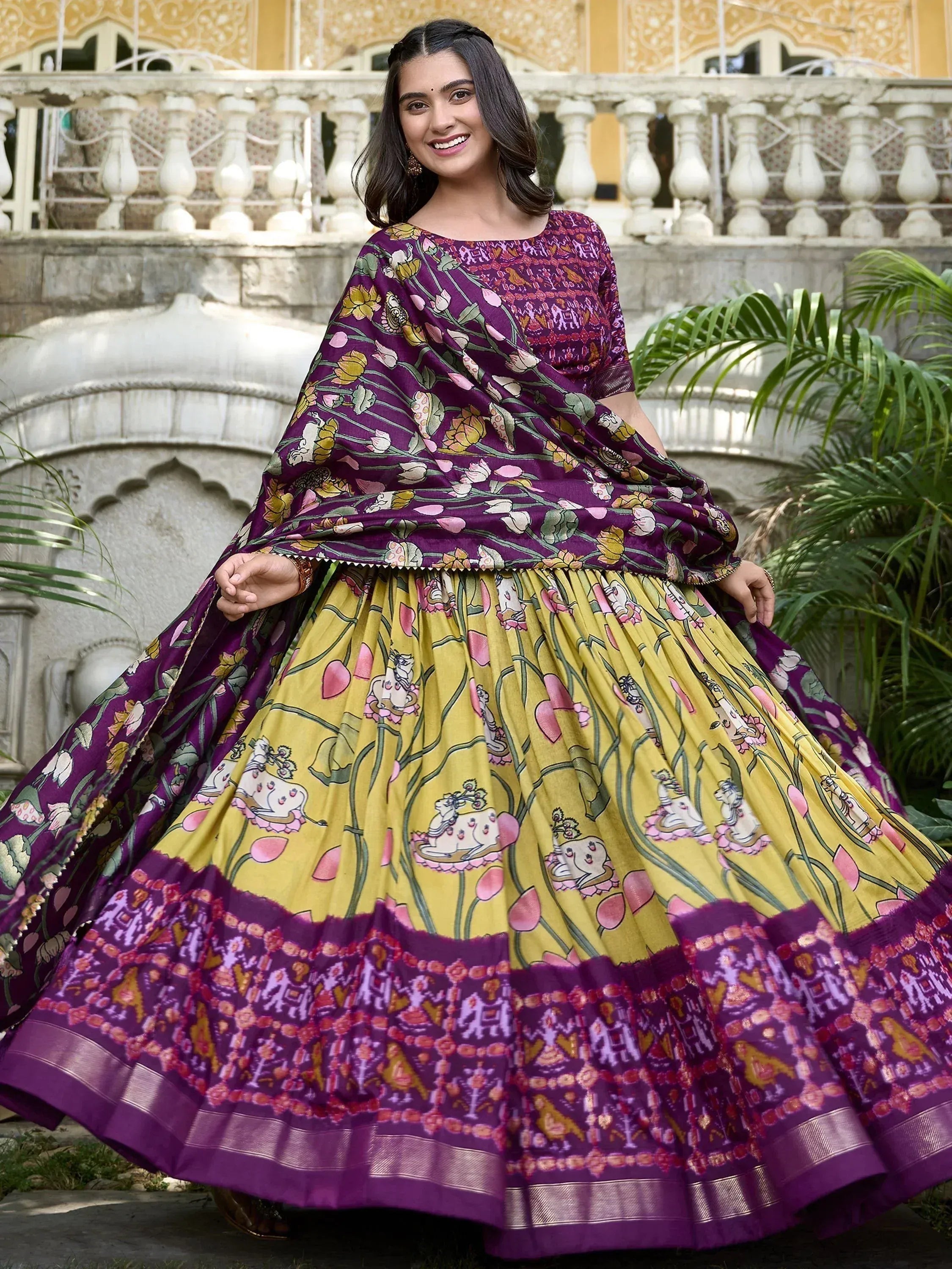 Purple and yellow floral printed lehenga choli with traditional Indian motifs, perfect for ethnic occasions.