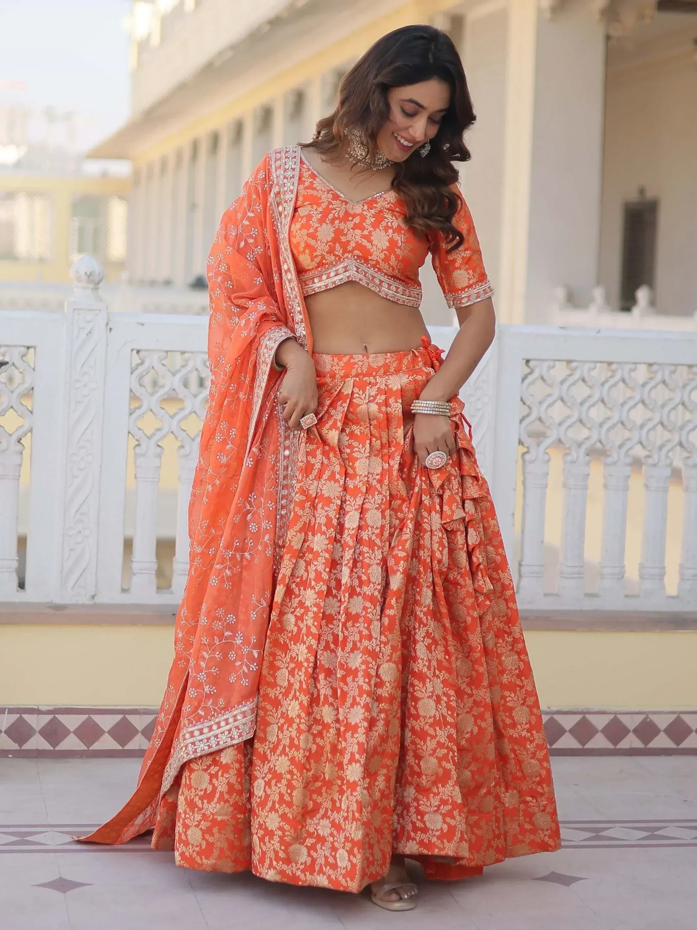 Orange floral lehenga choli with embroidered dupatta, perfect for Indian ethnic wear occasions