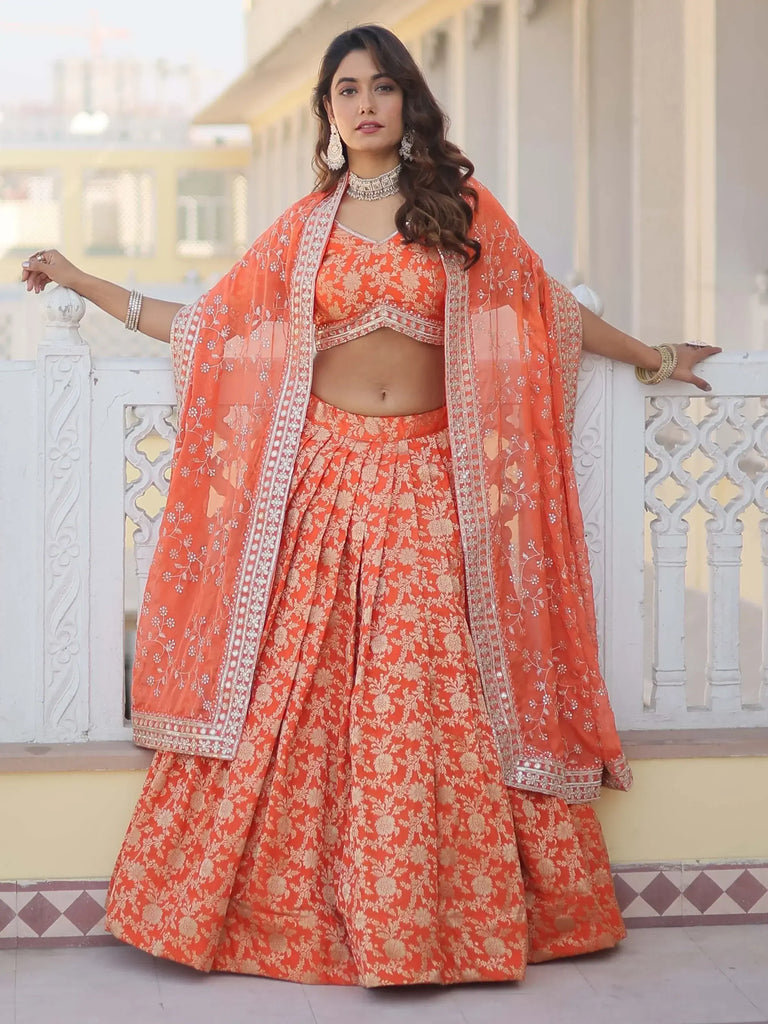 Astonishing Orange Embroidered Jacquard Wedding Wear Lehenga Choli