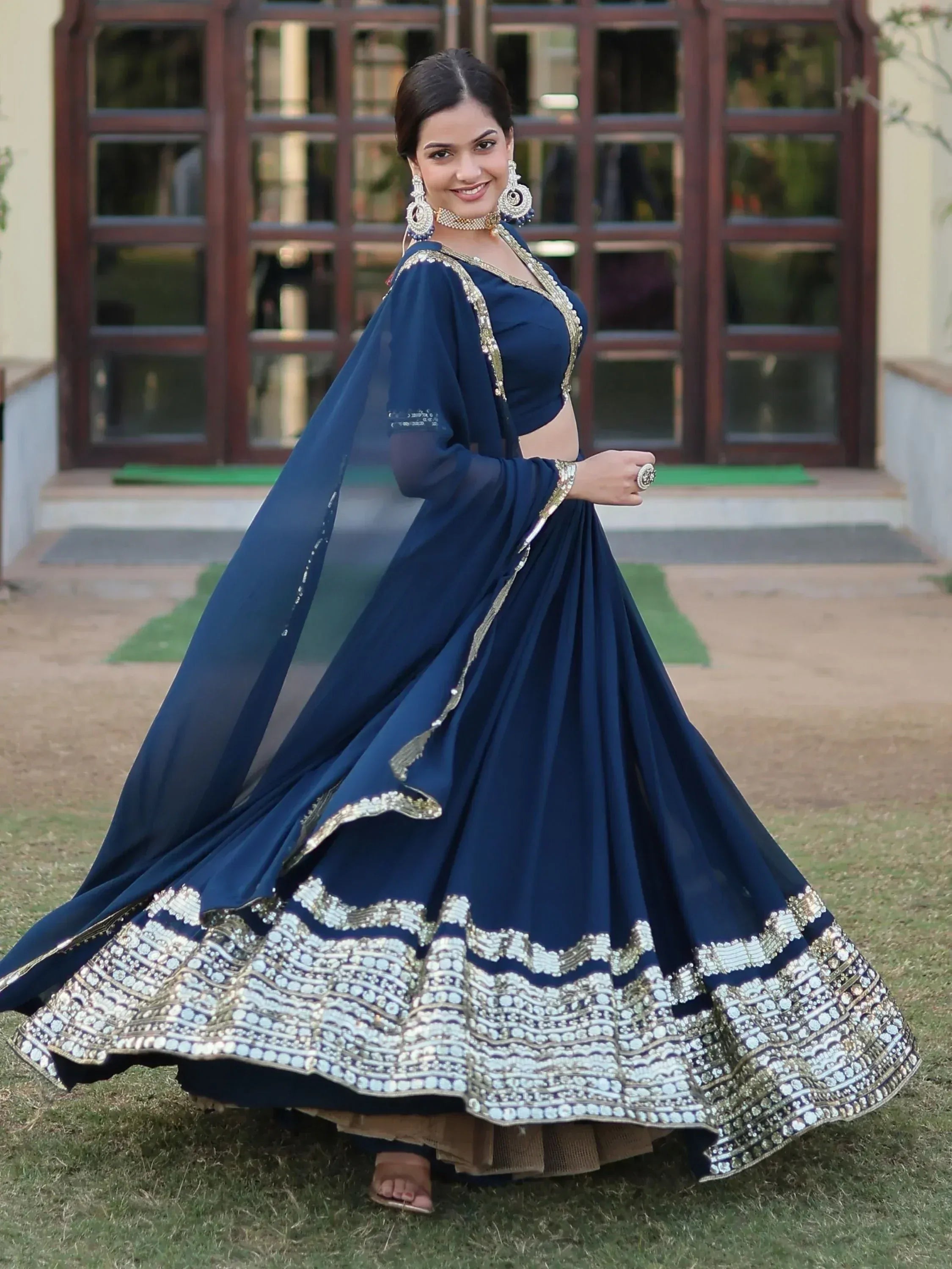 Navy blue designer lehenga choli with gold embroidery, perfect for Indian ethnic wear and festive occasions.