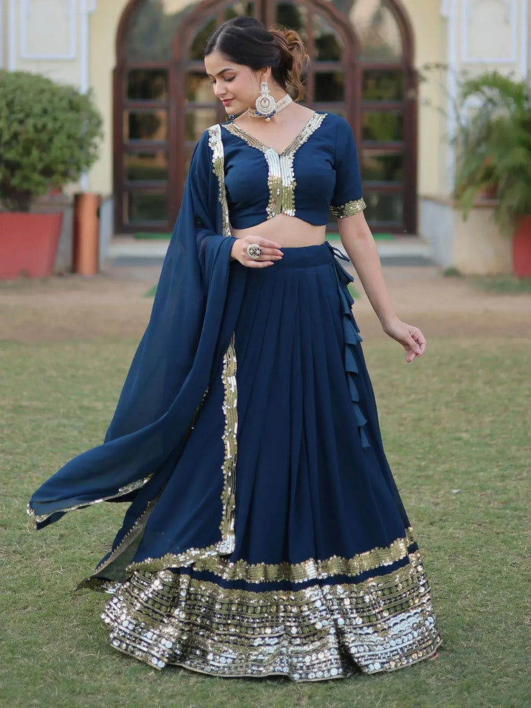 Navy blue designer lehenga choli with gold embroidery, perfect for Indian ethnic wear events