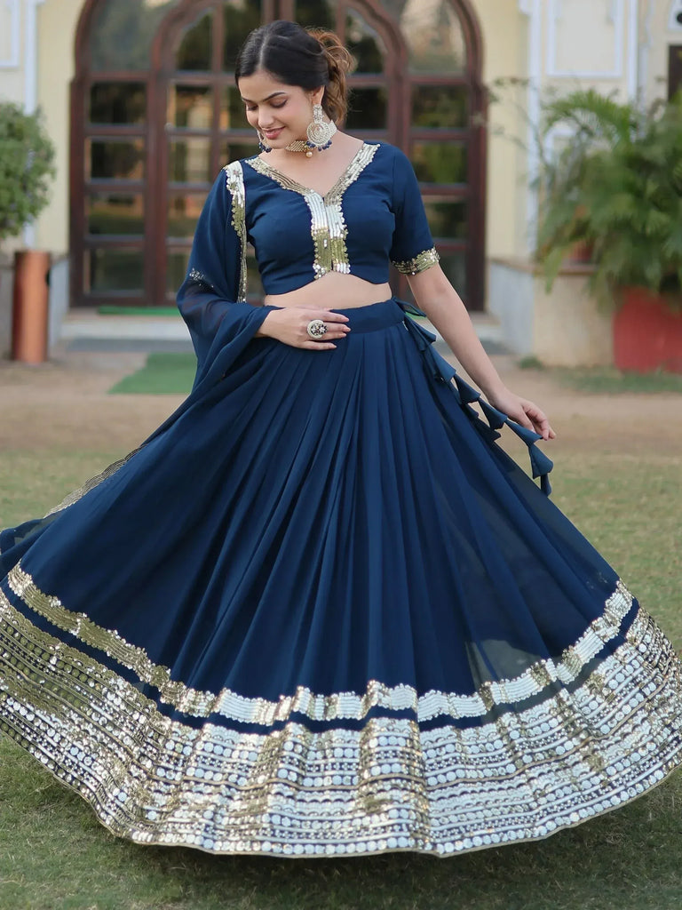 Navy blue designer lehenga choli with gold embroidery, perfect for Indian ethnic wear occasions